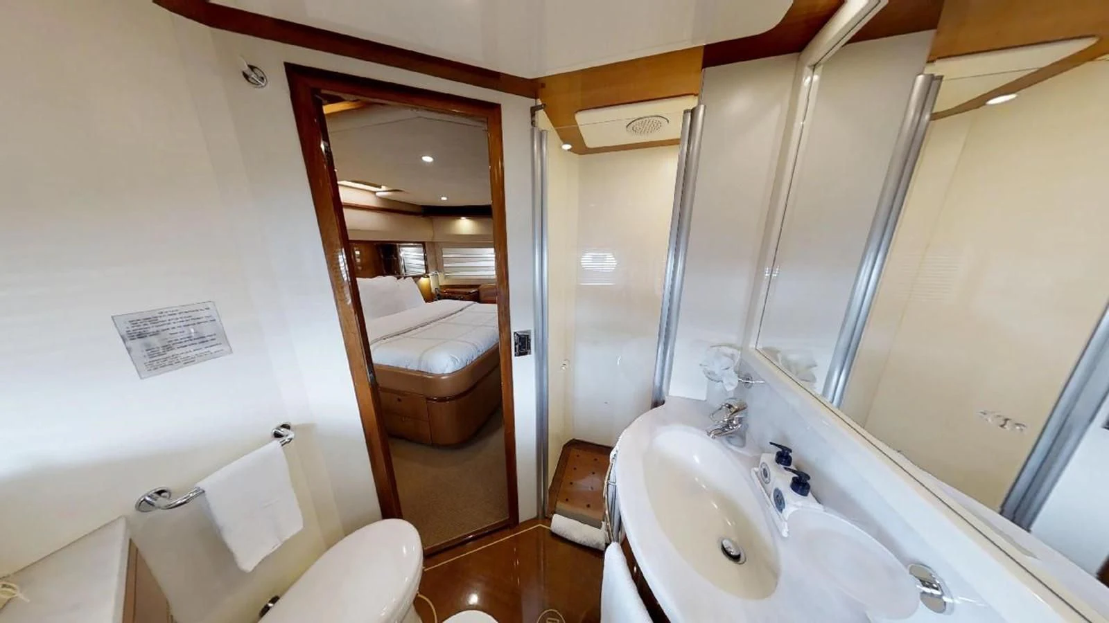 a bathroom with a sink and a mirror aboard INDULGE II Yacht for Sale