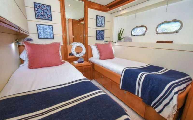 a couple of beds in a room aboard INDULGE II Yacht for Sale