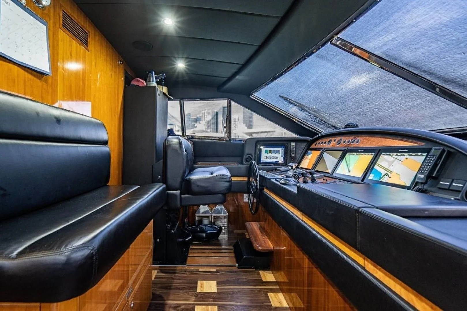 inside of a vehicle with a large black seat and a black seat aboard INDULGE II Yacht for Sale