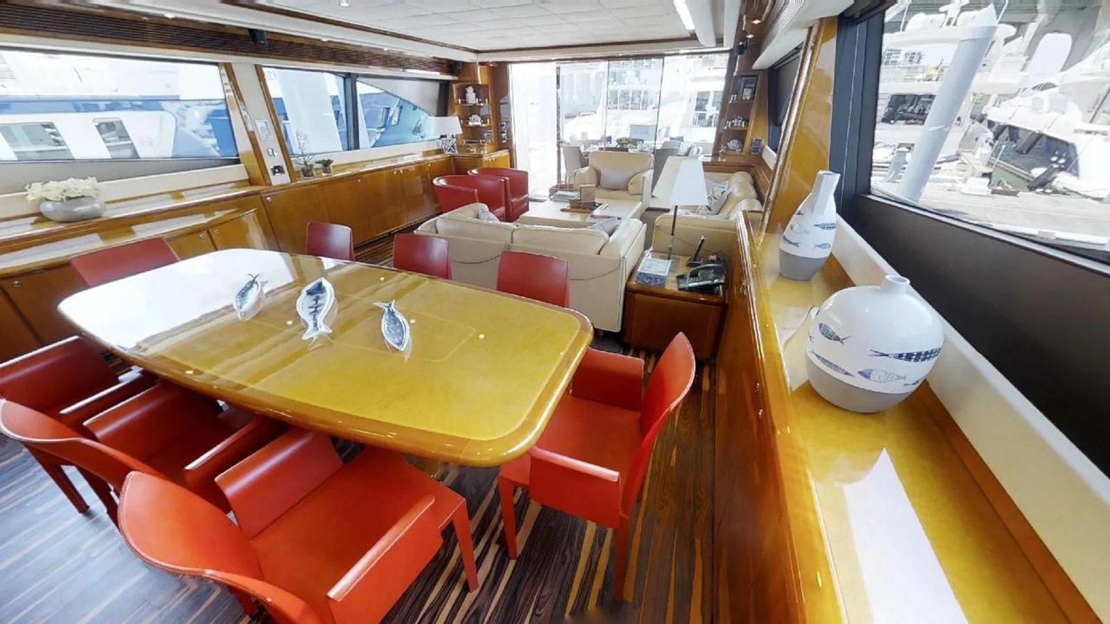 a room with a table and chairs aboard INDULGE II Yacht for Sale