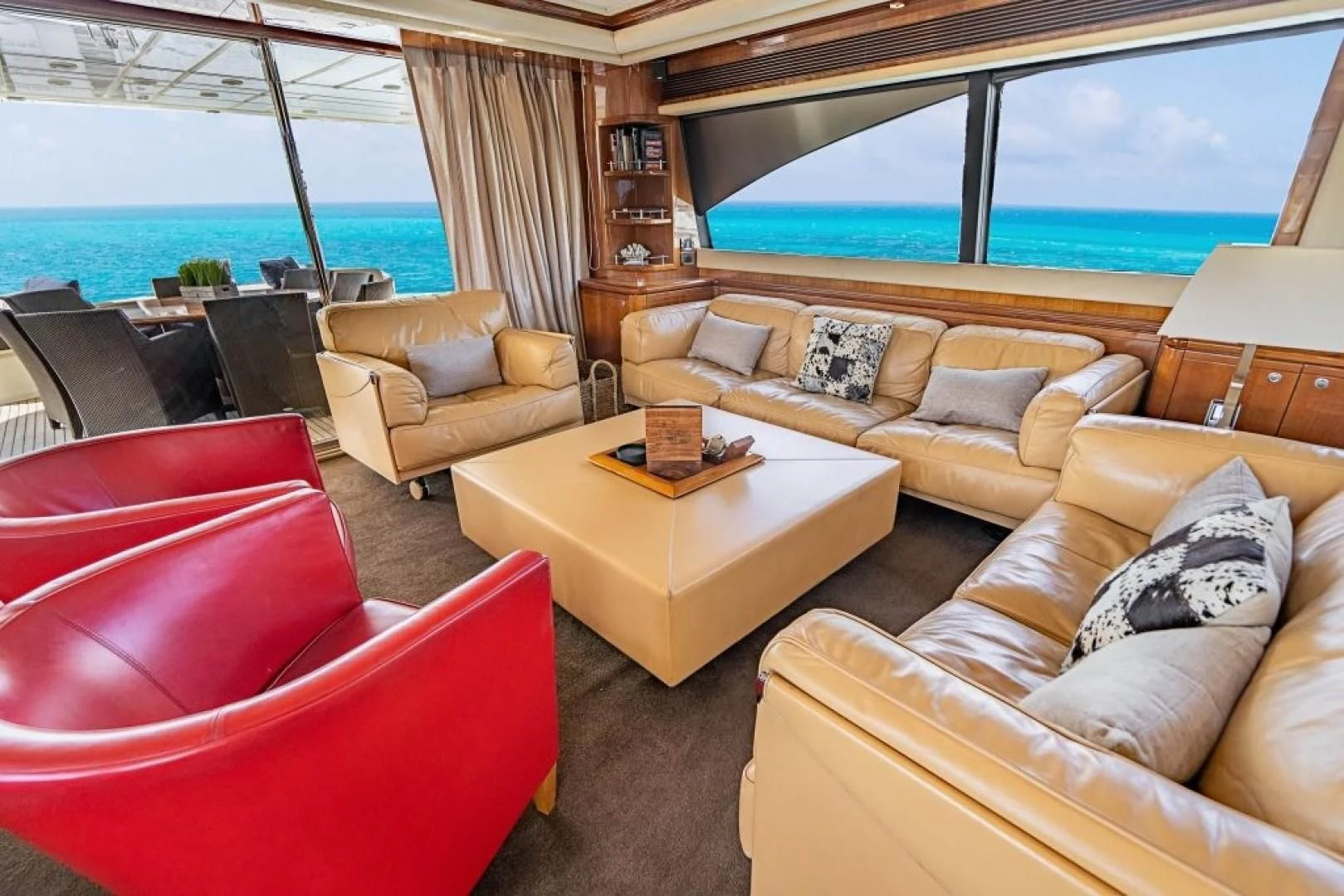 a living room with a large window aboard INDULGE II Yacht for Sale