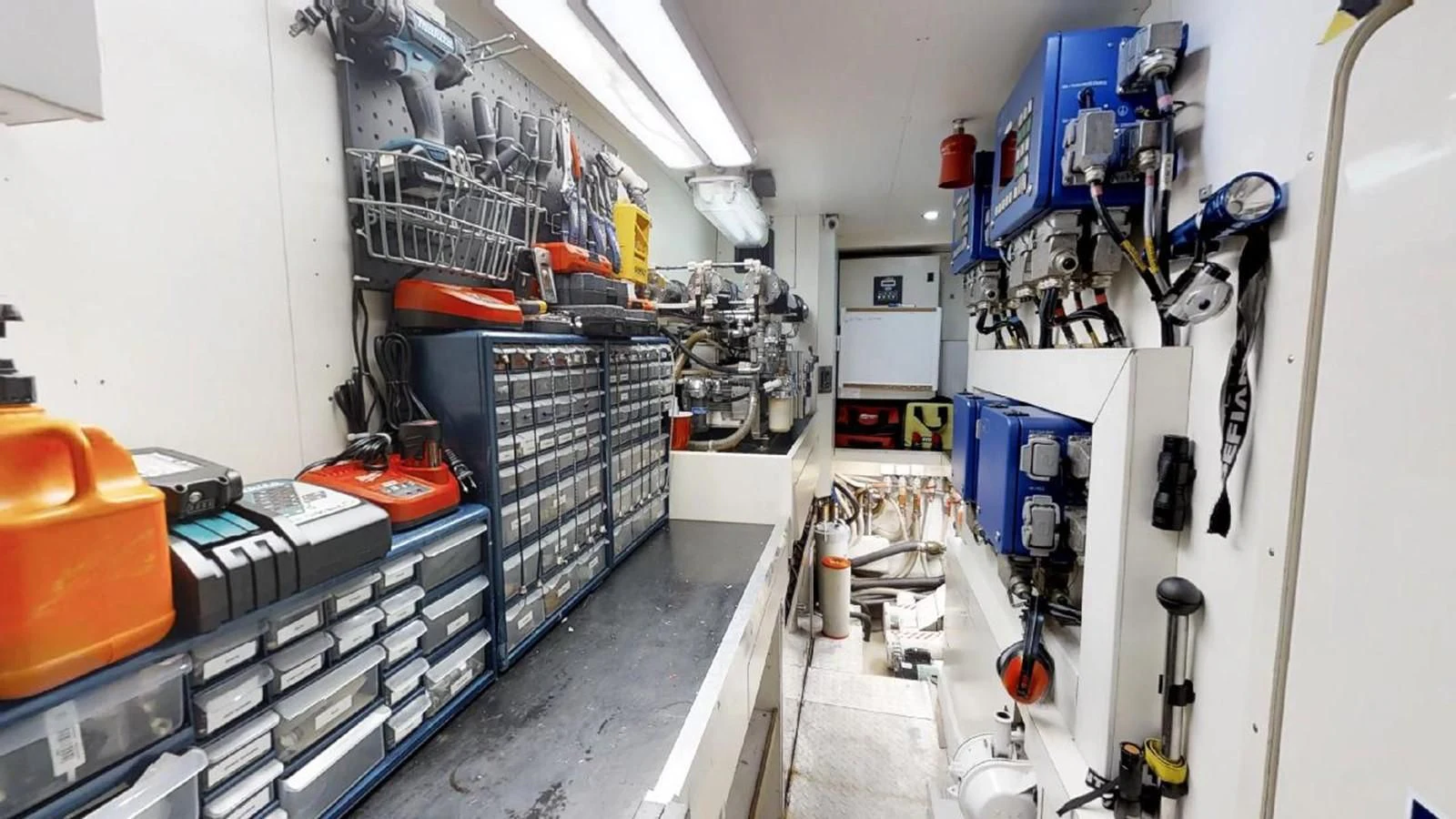 a room with machinery aboard INDULGE II Yacht for Sale