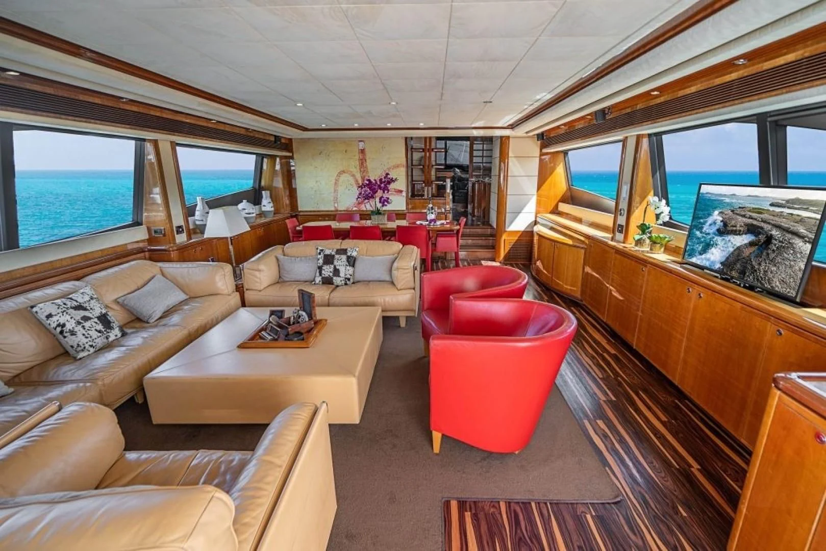 a living room with a couch and a table aboard INDULGE II Yacht for Sale