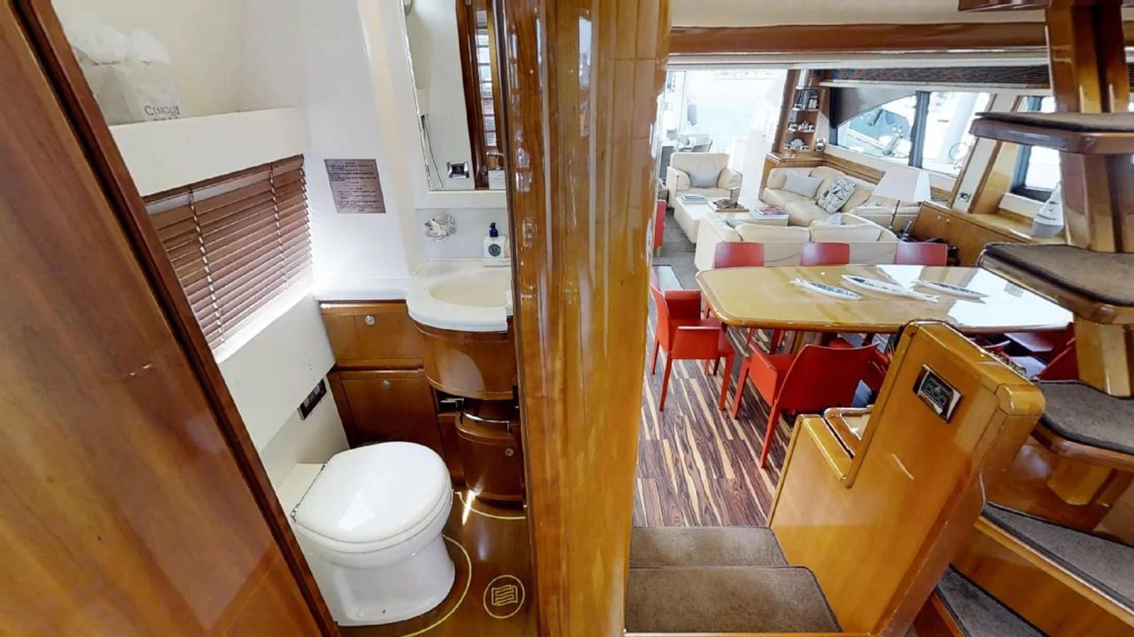 a small bathroom with a toilet aboard INDULGE II Yacht for Sale