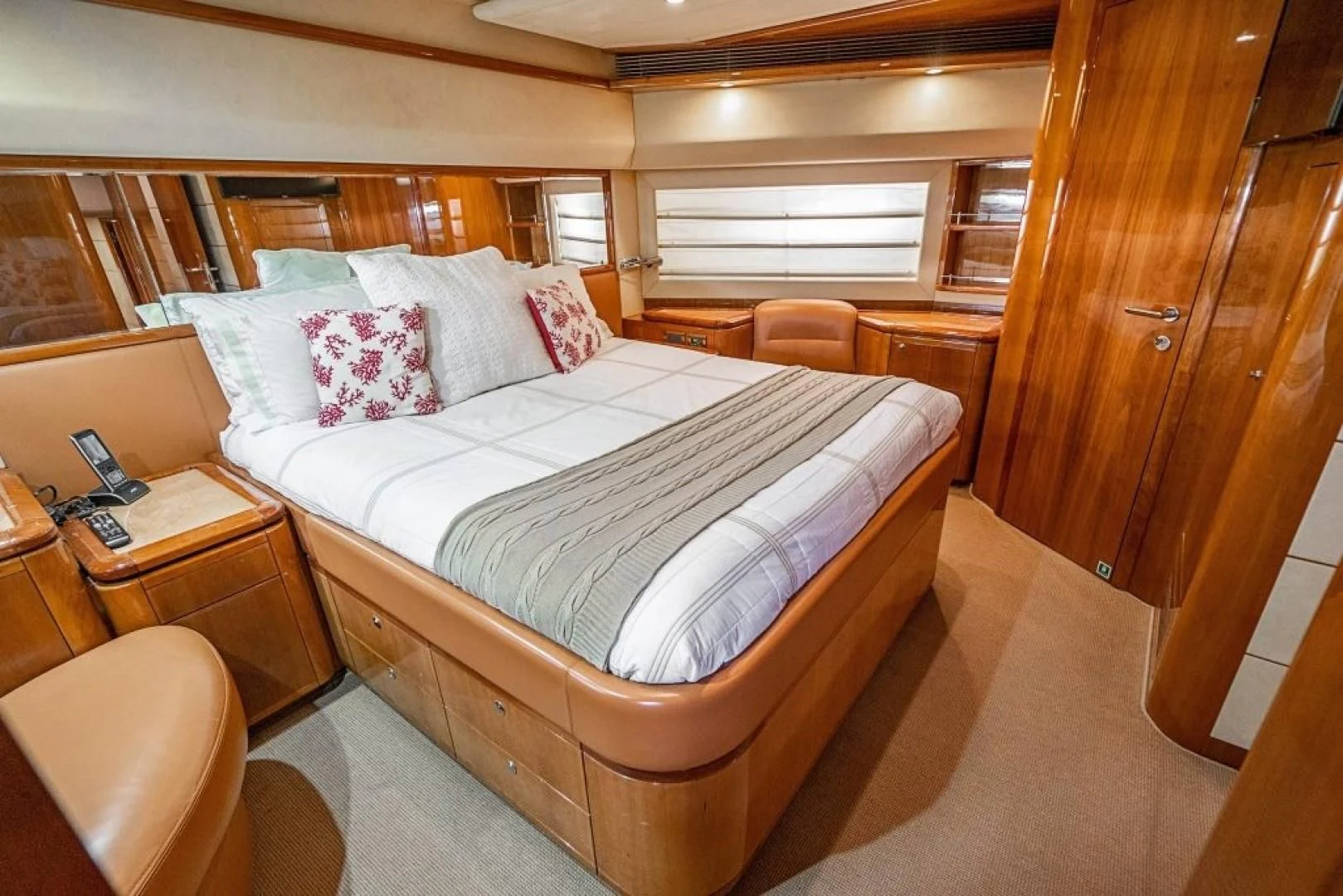 a bed in a room aboard INDULGE II Yacht for Sale