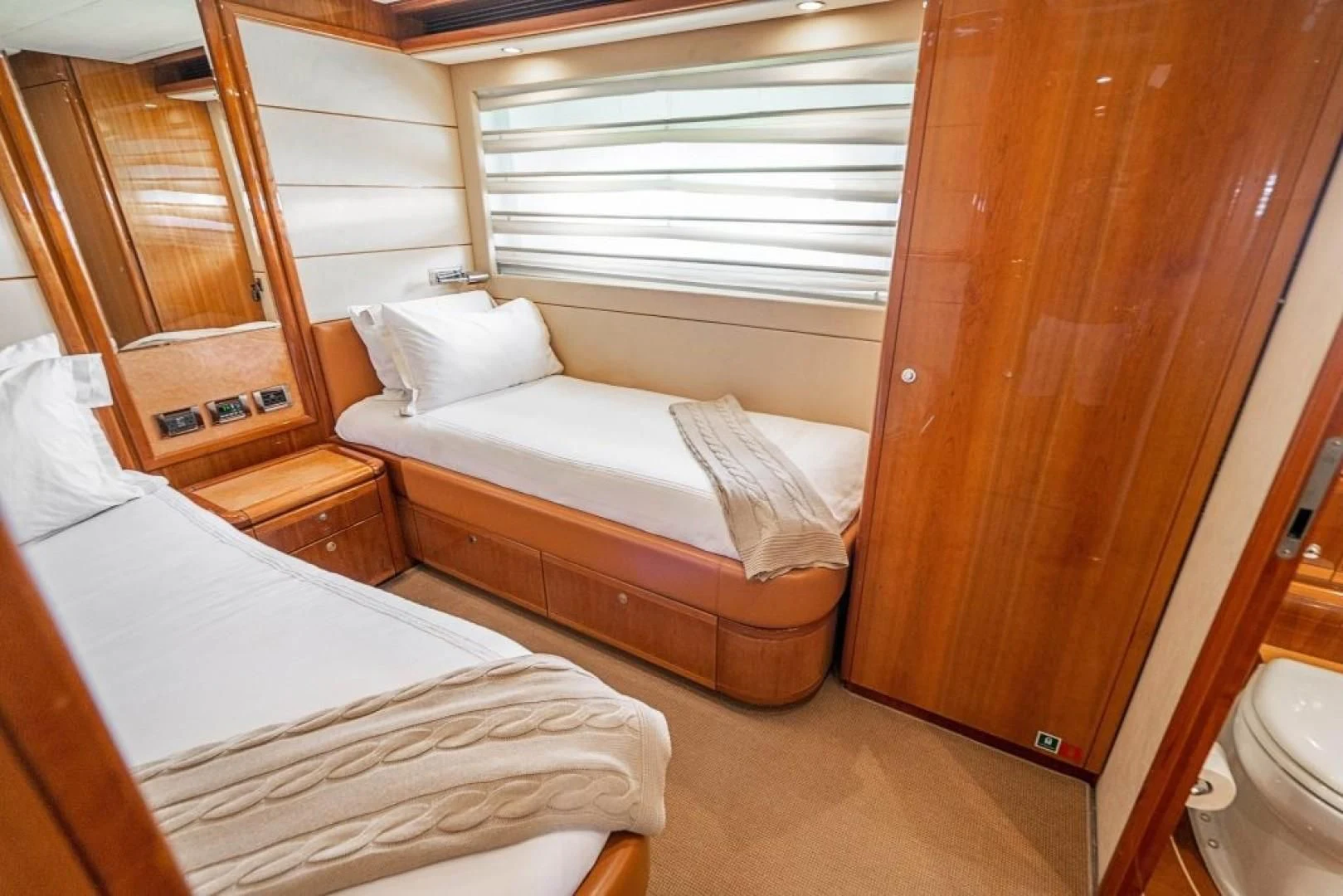 a couple of beds in a room aboard INDULGE II Yacht for Sale