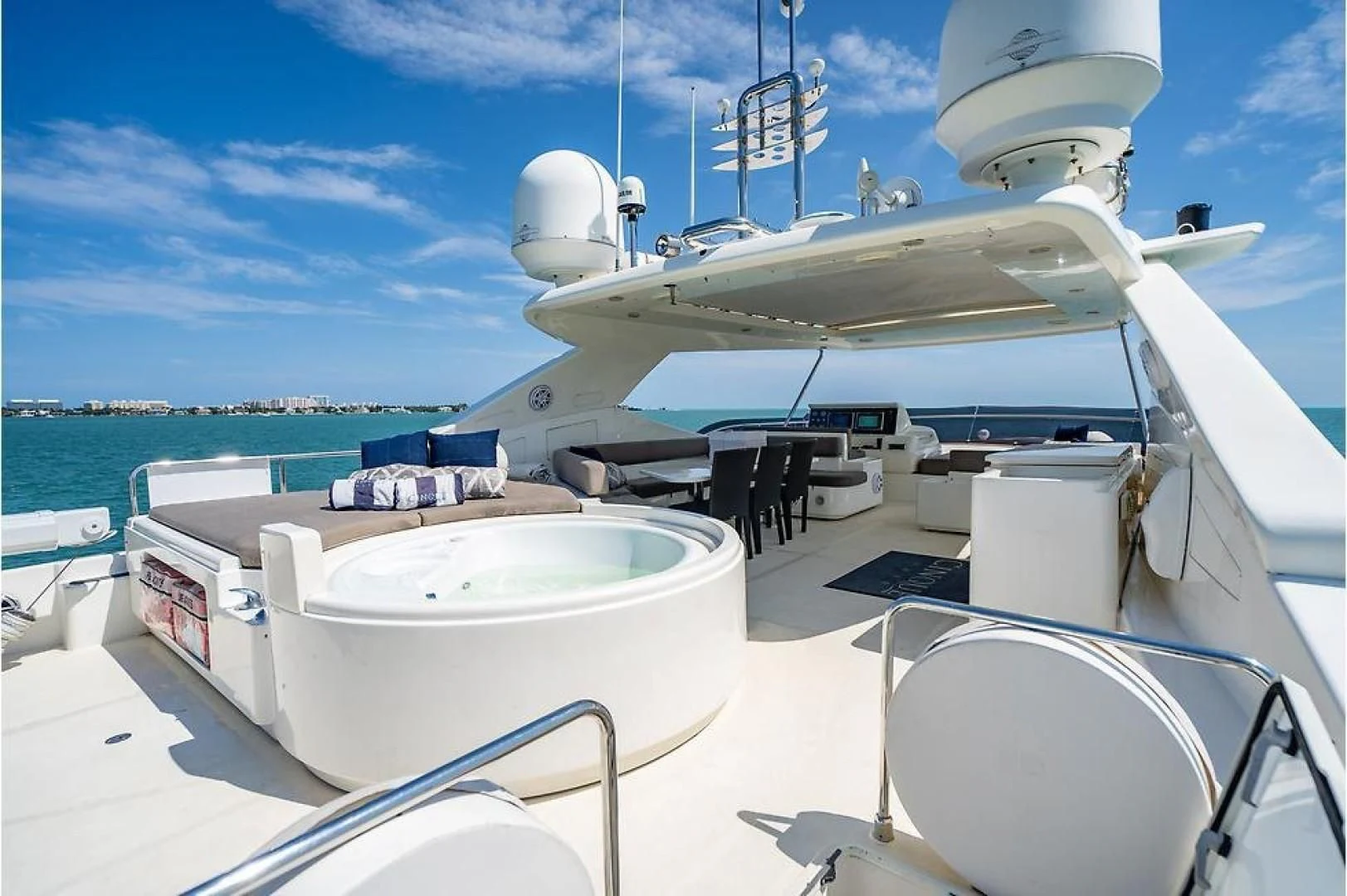 a large white boat with a large white round object on it aboard INDULGE II Yacht for Sale