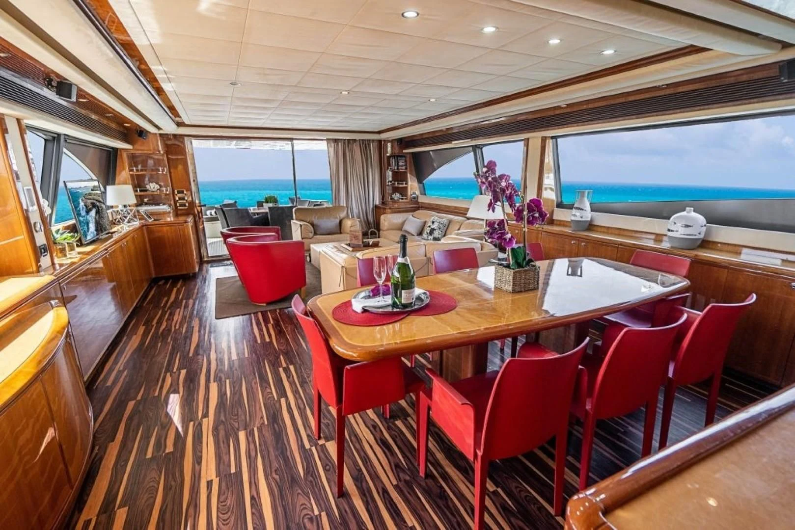 a dining room with a table and chairs aboard INDULGE II Yacht for Sale