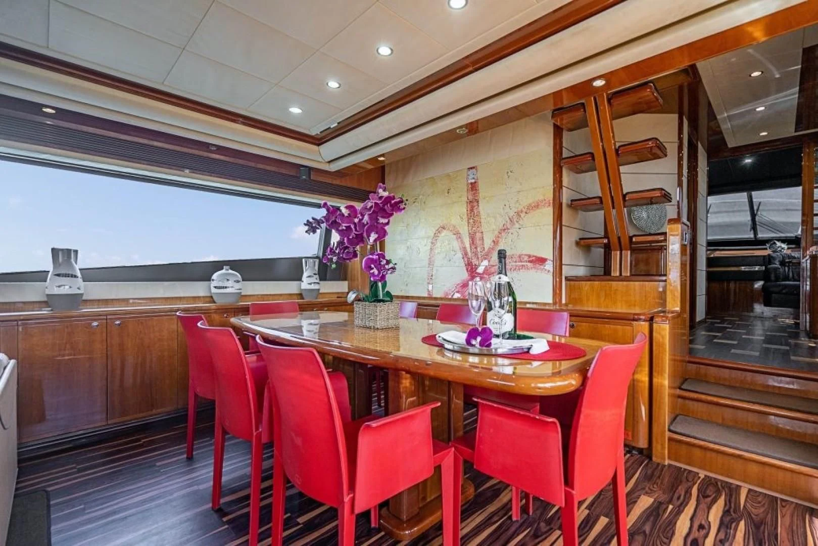 a dining table in a restaurant aboard INDULGE II Yacht for Sale