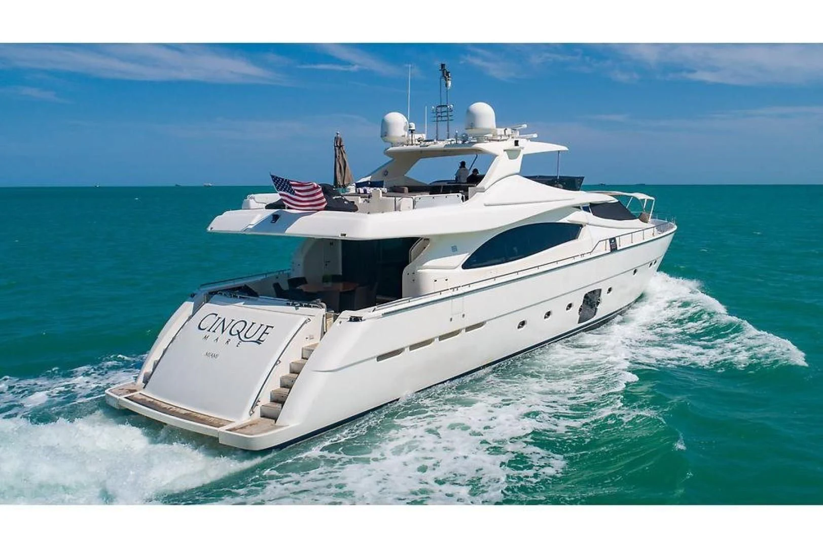 a white boat in the ocean aboard INDULGE II Yacht for Sale
