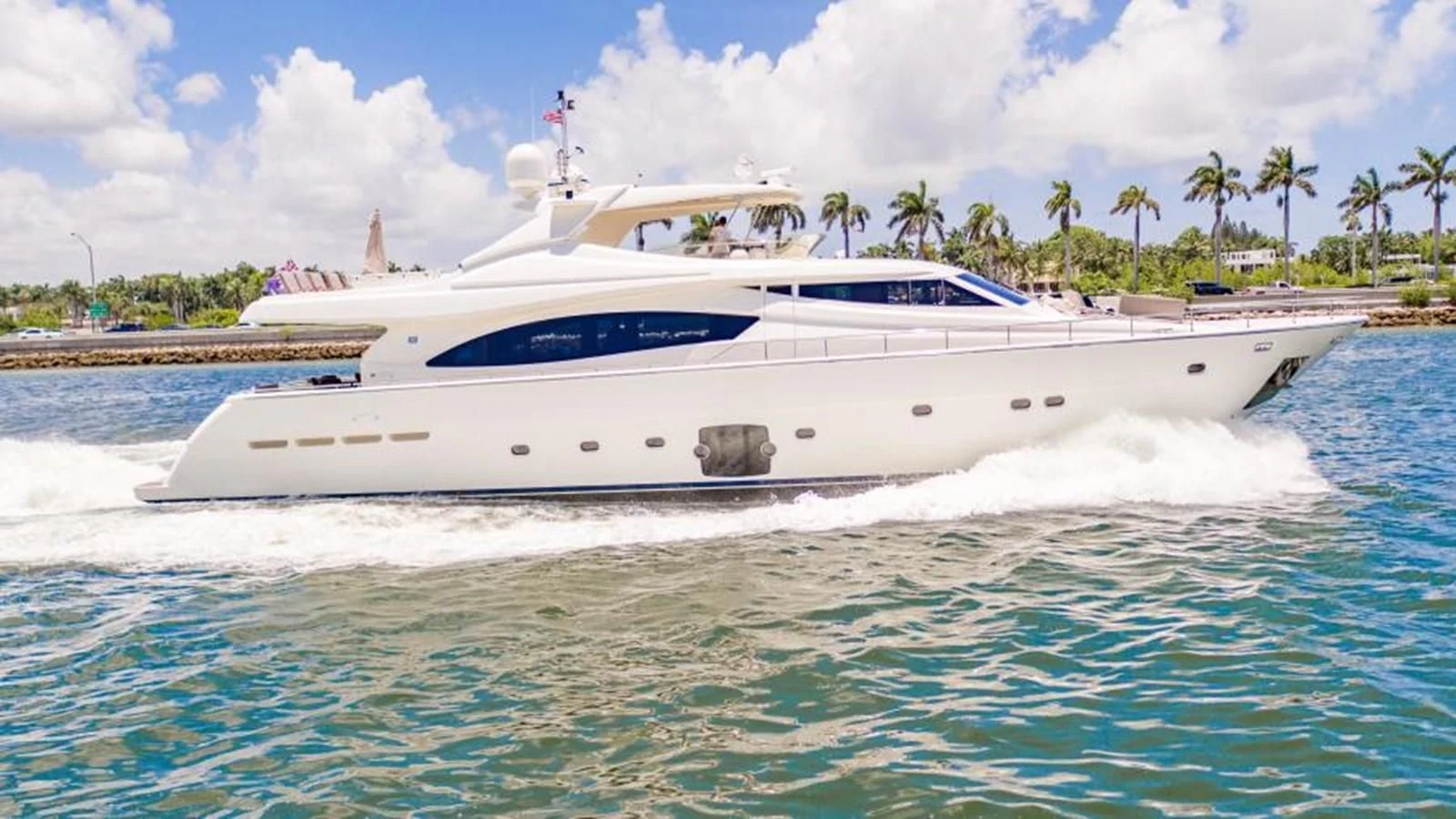 a white boat on the water aboard INDULGE II Yacht for Sale