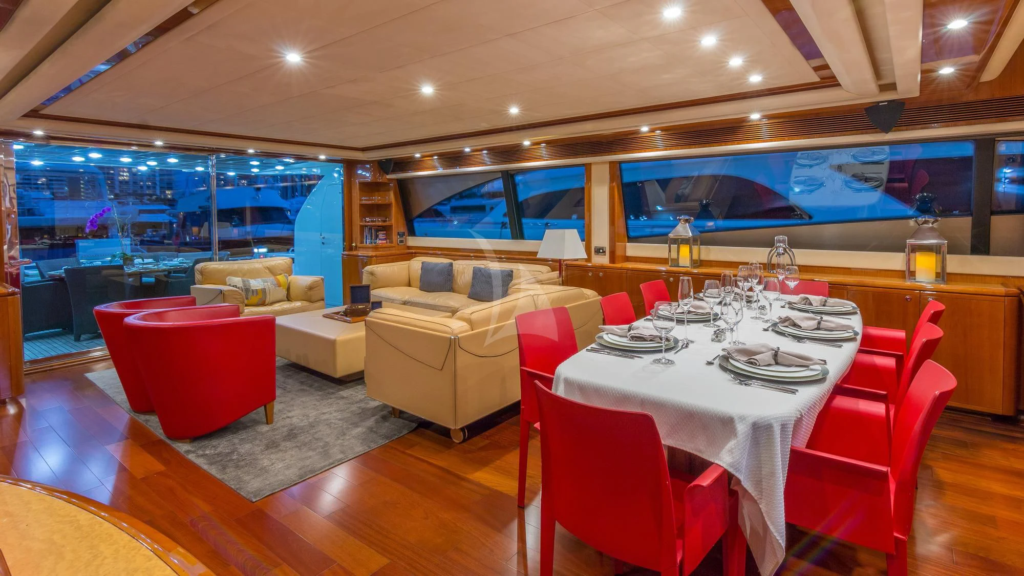 a room with a table and chairs aboard INDULGE II Yacht for Sale