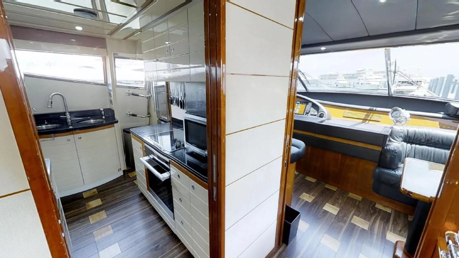a kitchen with a glass door aboard INDULGE II Yacht for Sale