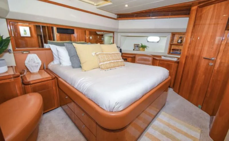 a bed in a room aboard INDULGE II Yacht for Sale