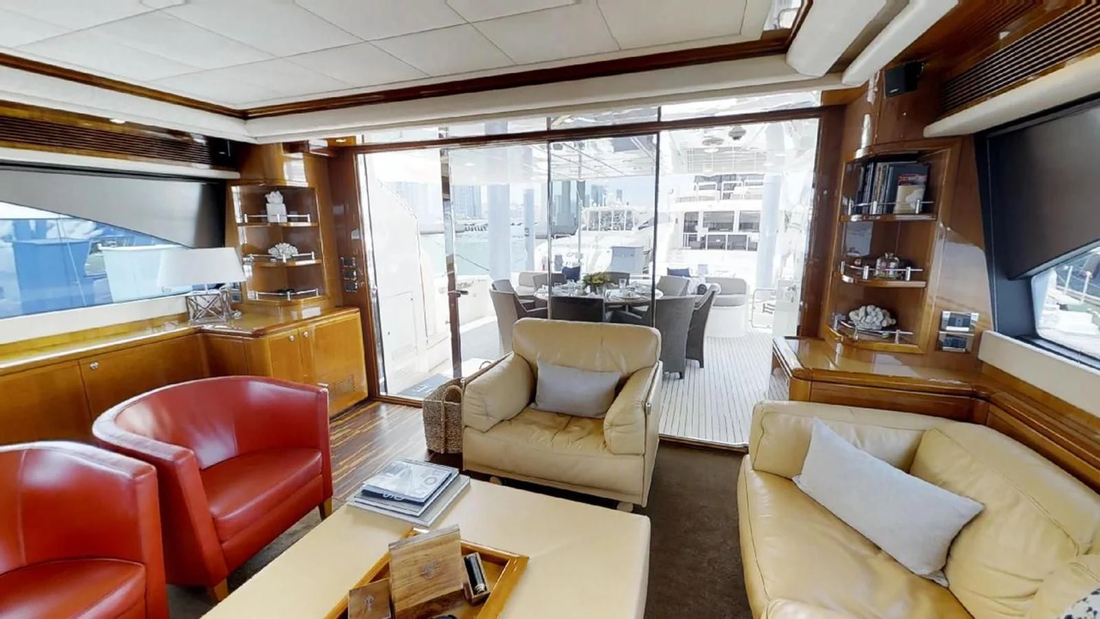 a living room with a large window aboard INDULGE II Yacht for Sale