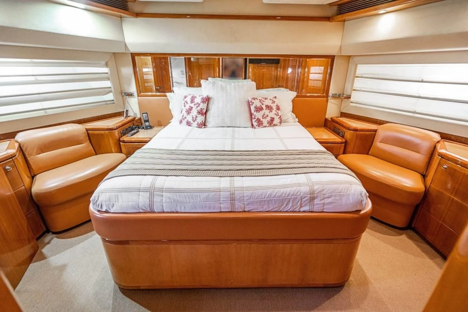 a large bed in a room aboard INDULGE II Yacht for Sale