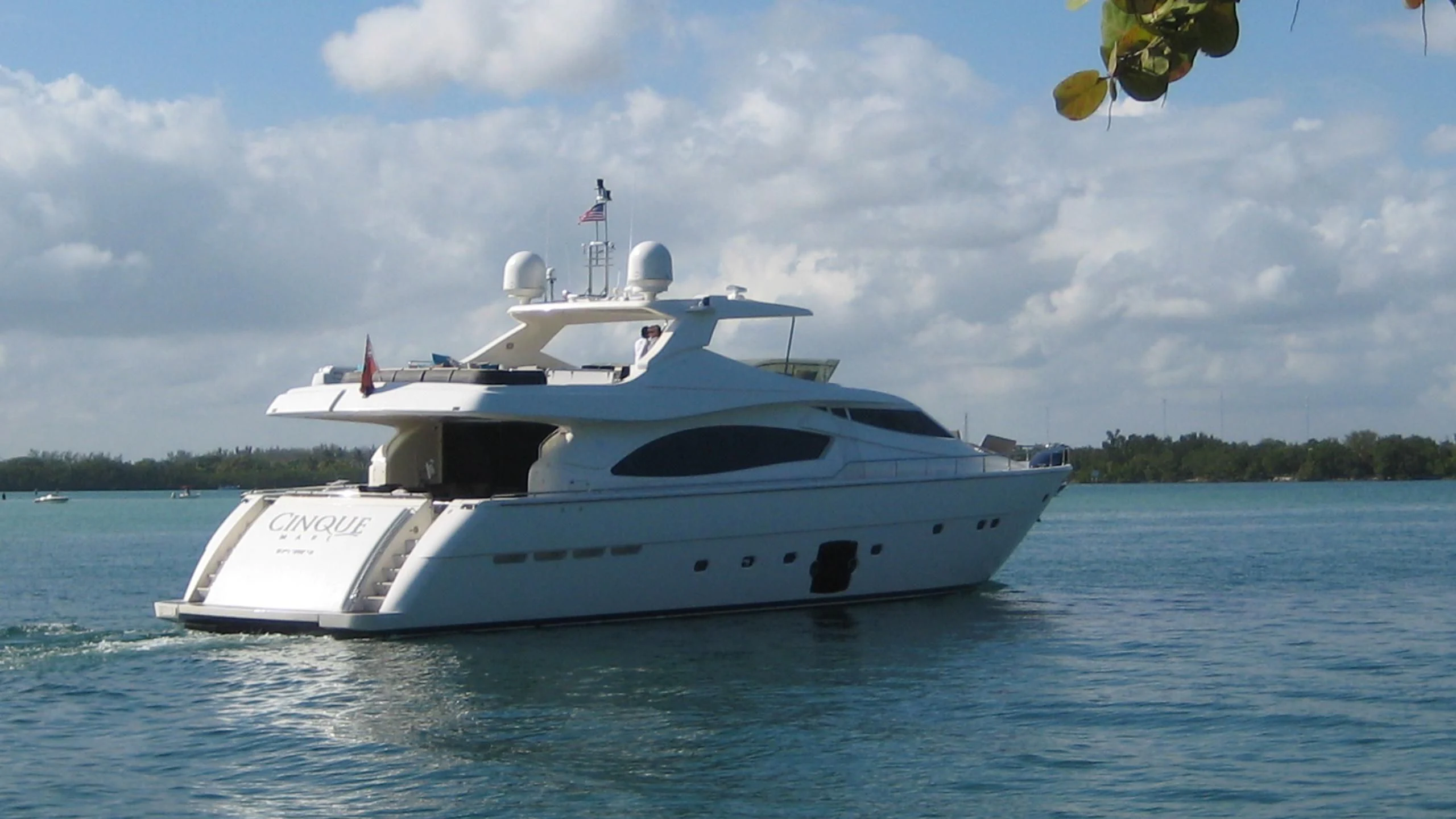 a white boat in the water aboard INDULGE II Yacht for Sale