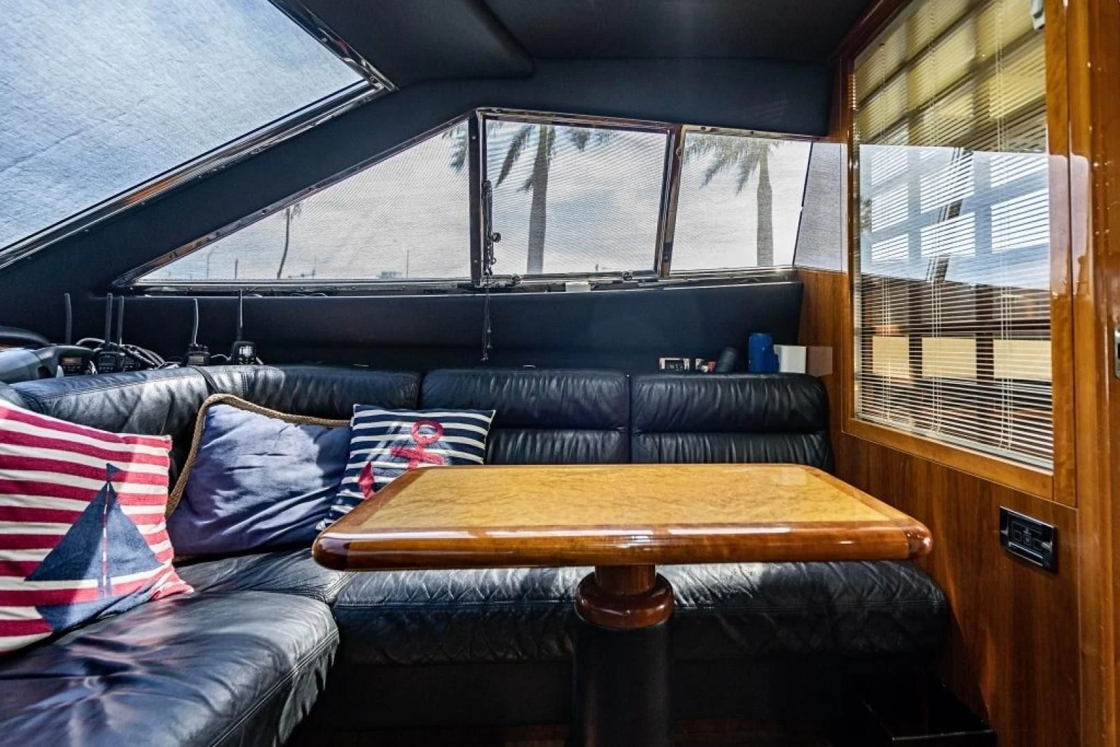 a couch and a table in a room aboard INDULGE II Yacht for Sale