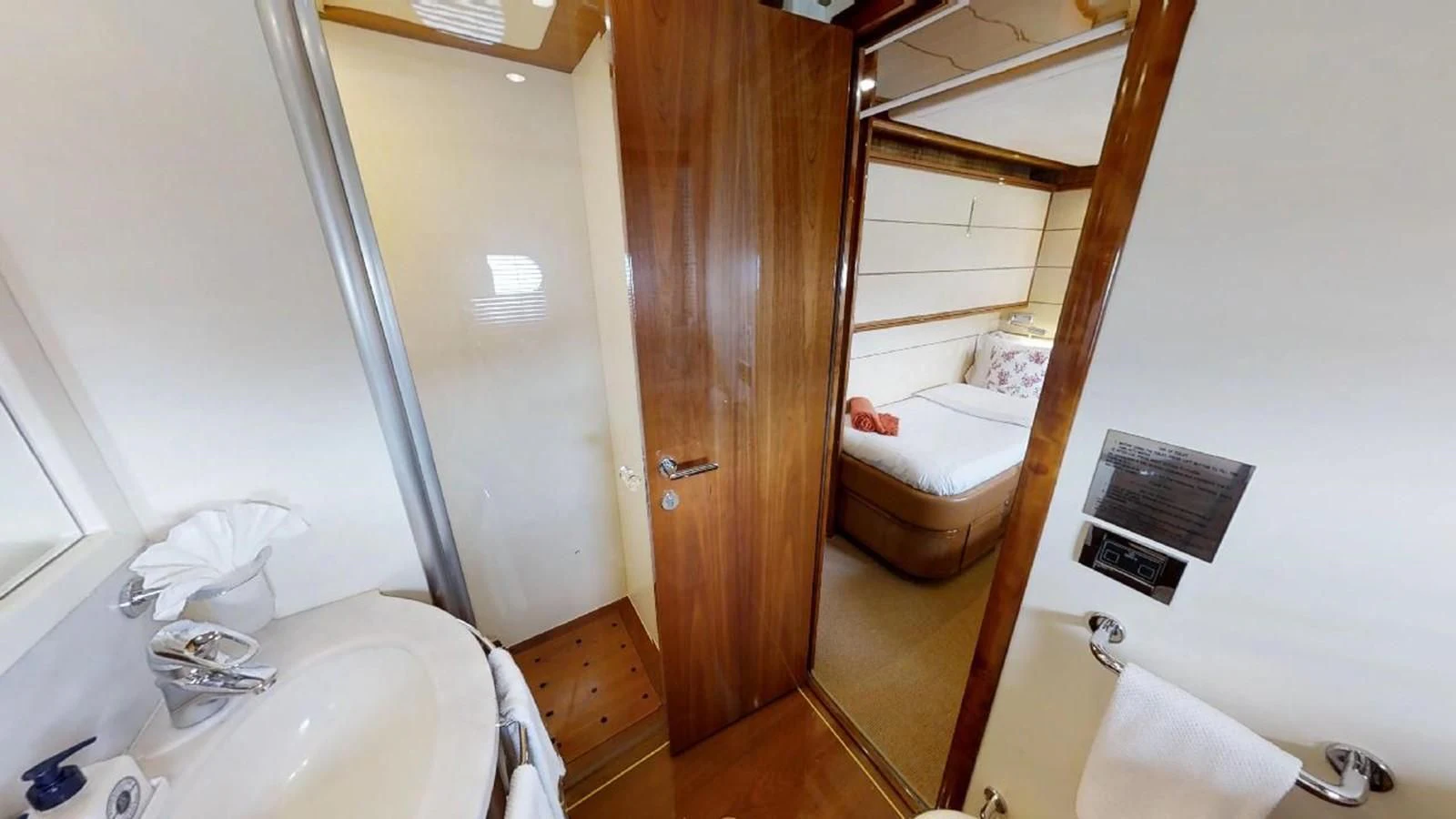 a bathroom with a sink and a mirror aboard INDULGE II Yacht for Sale