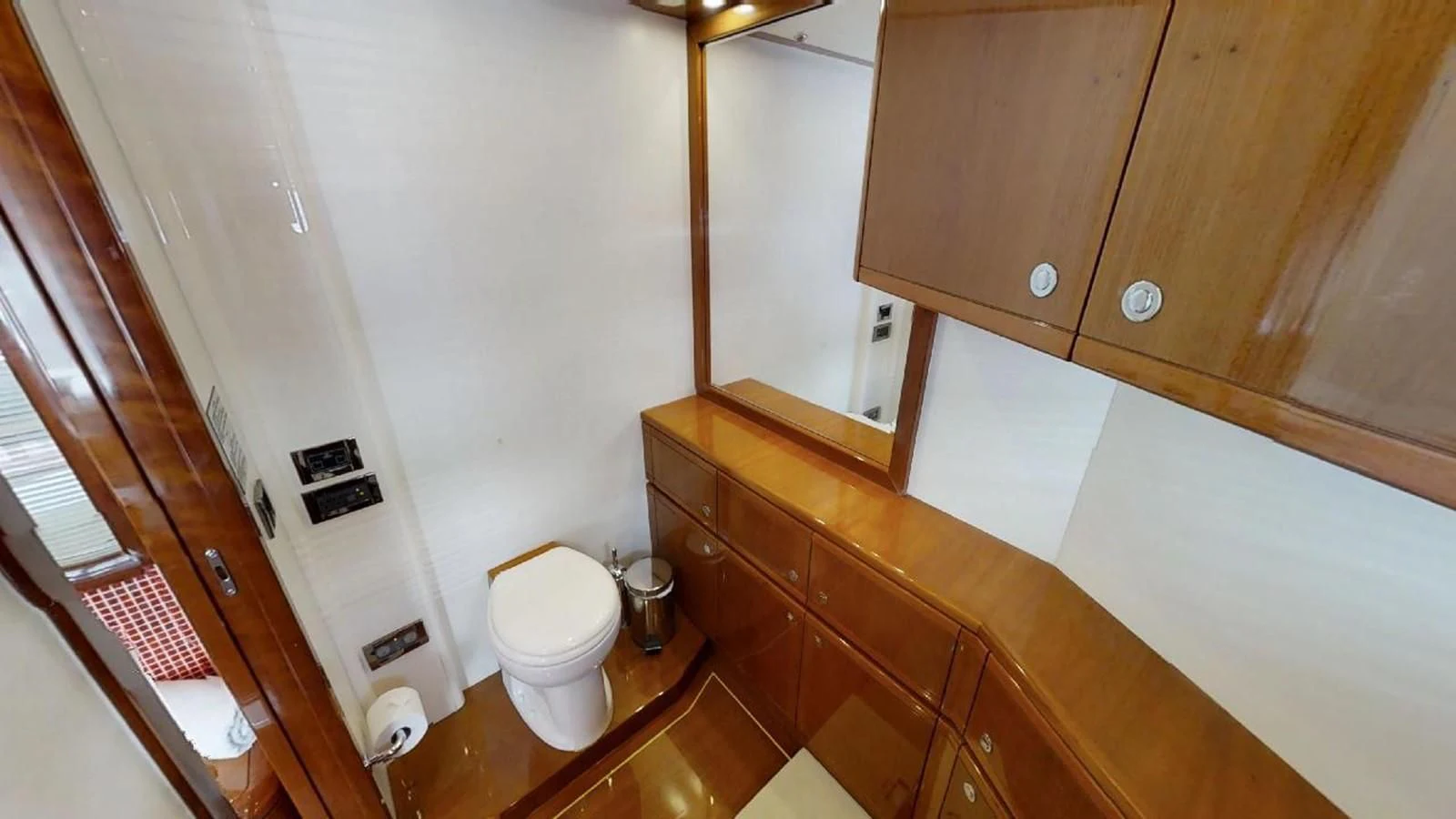 a bathroom with wooden cabinets aboard INDULGE II Yacht for Sale