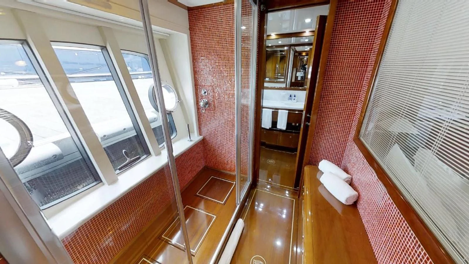 a room with a glass door and a window aboard INDULGE II Yacht for Sale