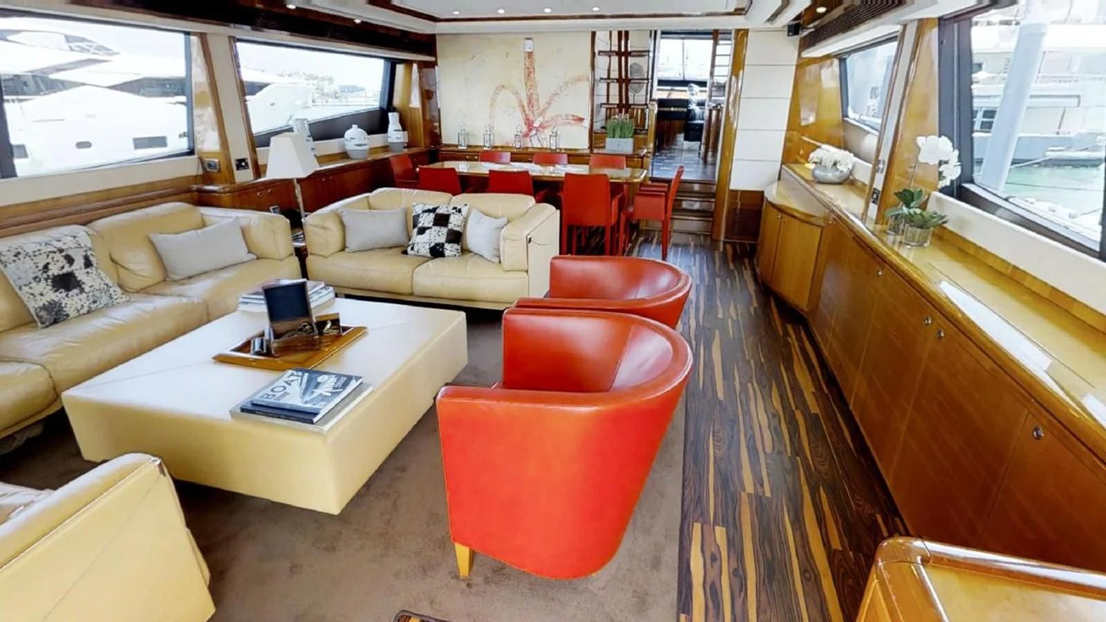 a living room with a large window aboard INDULGE II Yacht for Sale