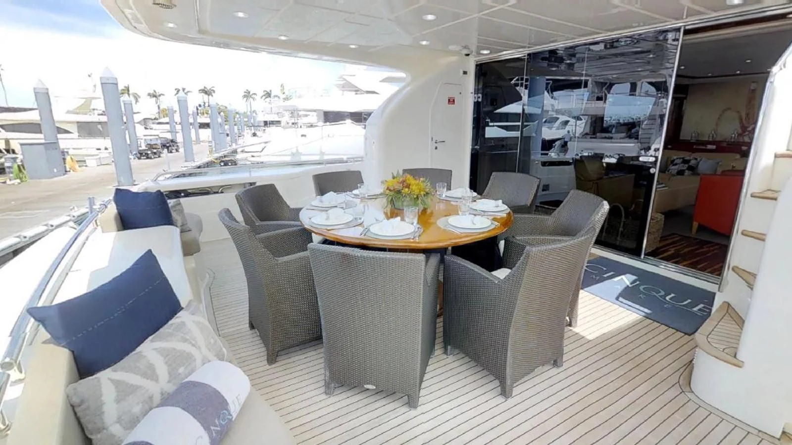 a room with a table chairs and a large window aboard INDULGE II Yacht for Sale