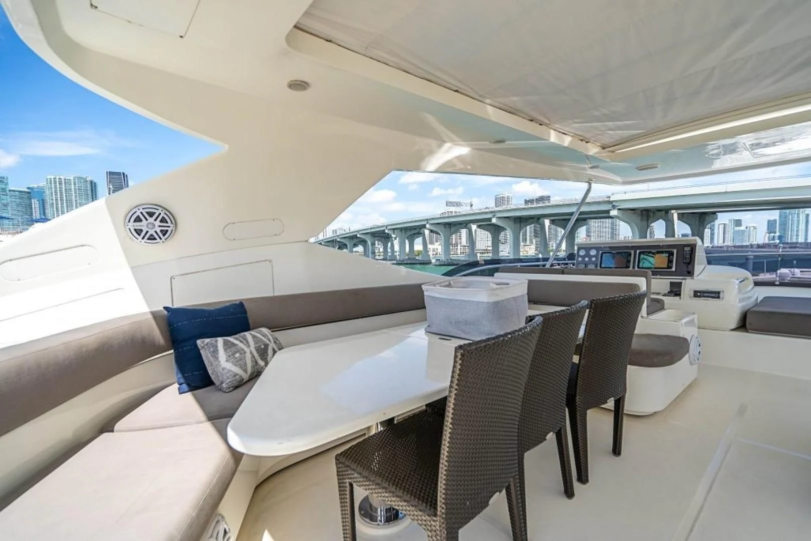 a room with a table and chairs aboard INDULGE II Yacht for Sale