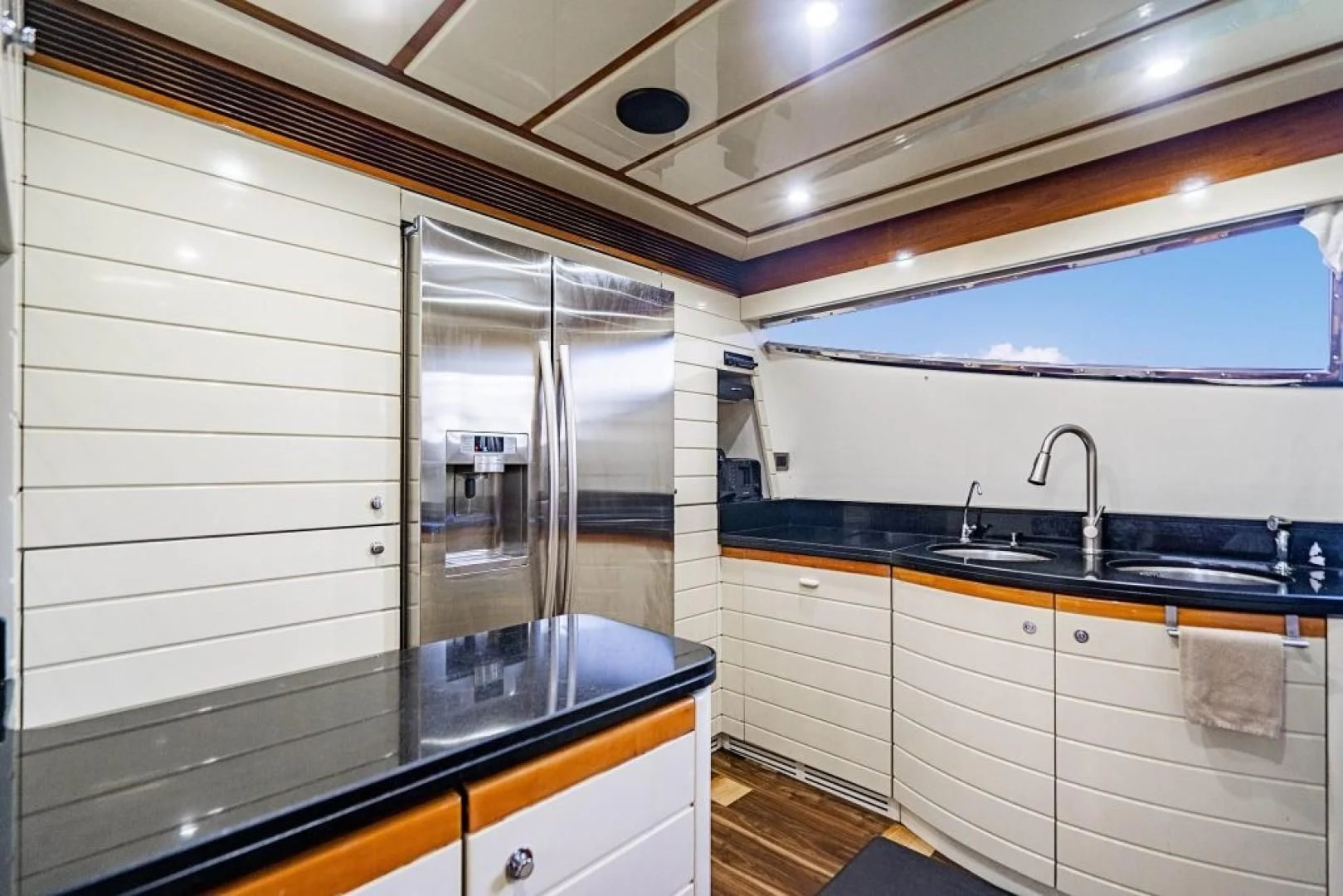 a bathroom with a glass shower aboard INDULGE II Yacht for Sale