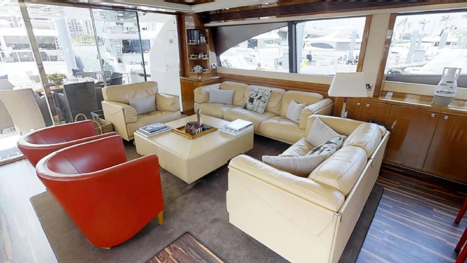 a living room with a couch and a coffee table aboard INDULGE II Yacht for Sale