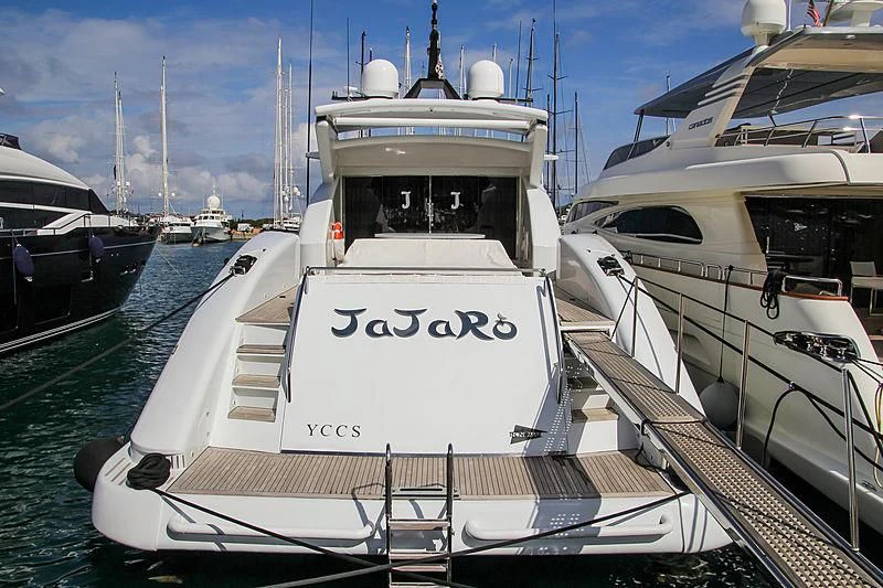 a white boat in a harbor aboard JAJARO' Yacht for Sale