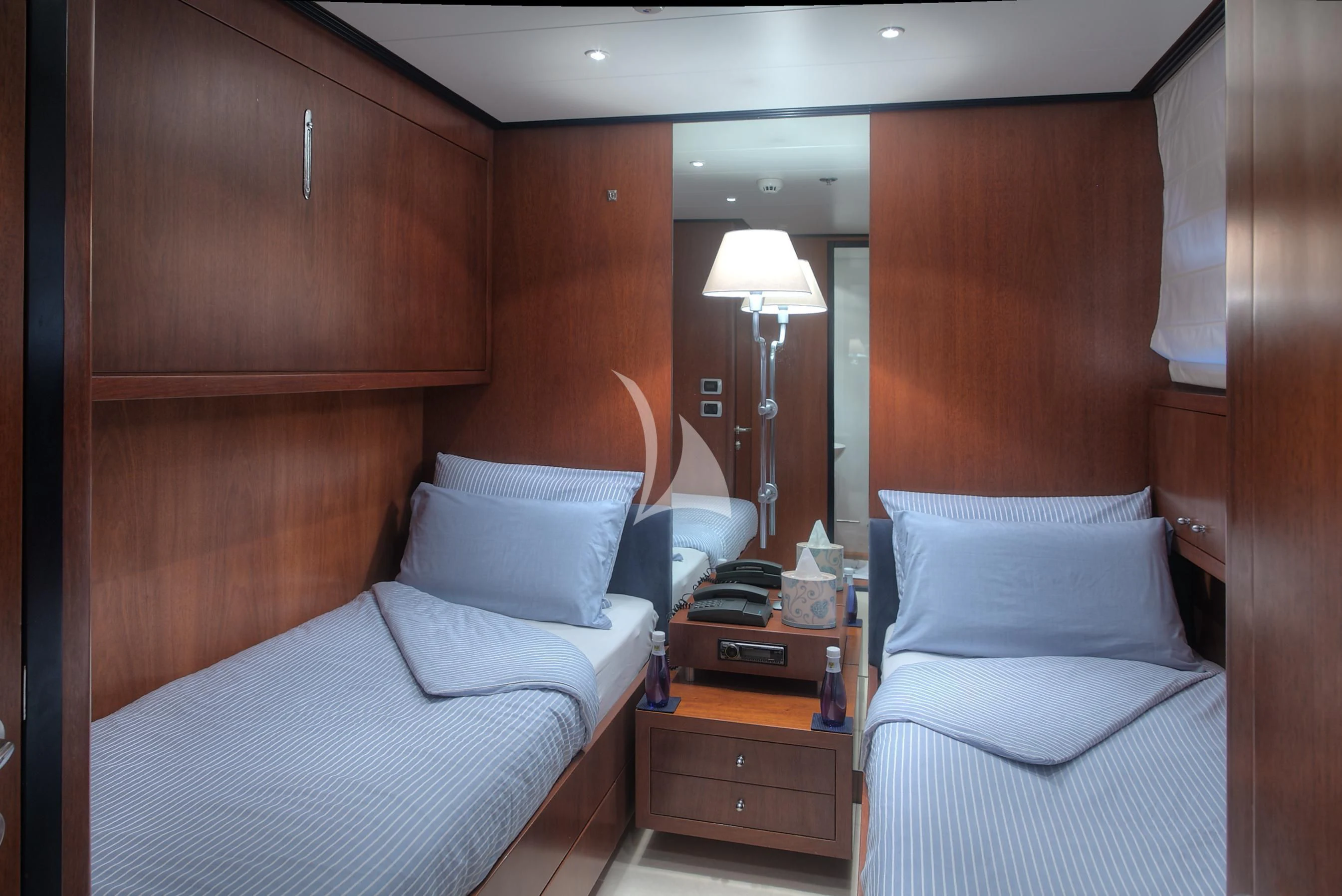 a room with two beds aboard CAROM Yacht for Sale