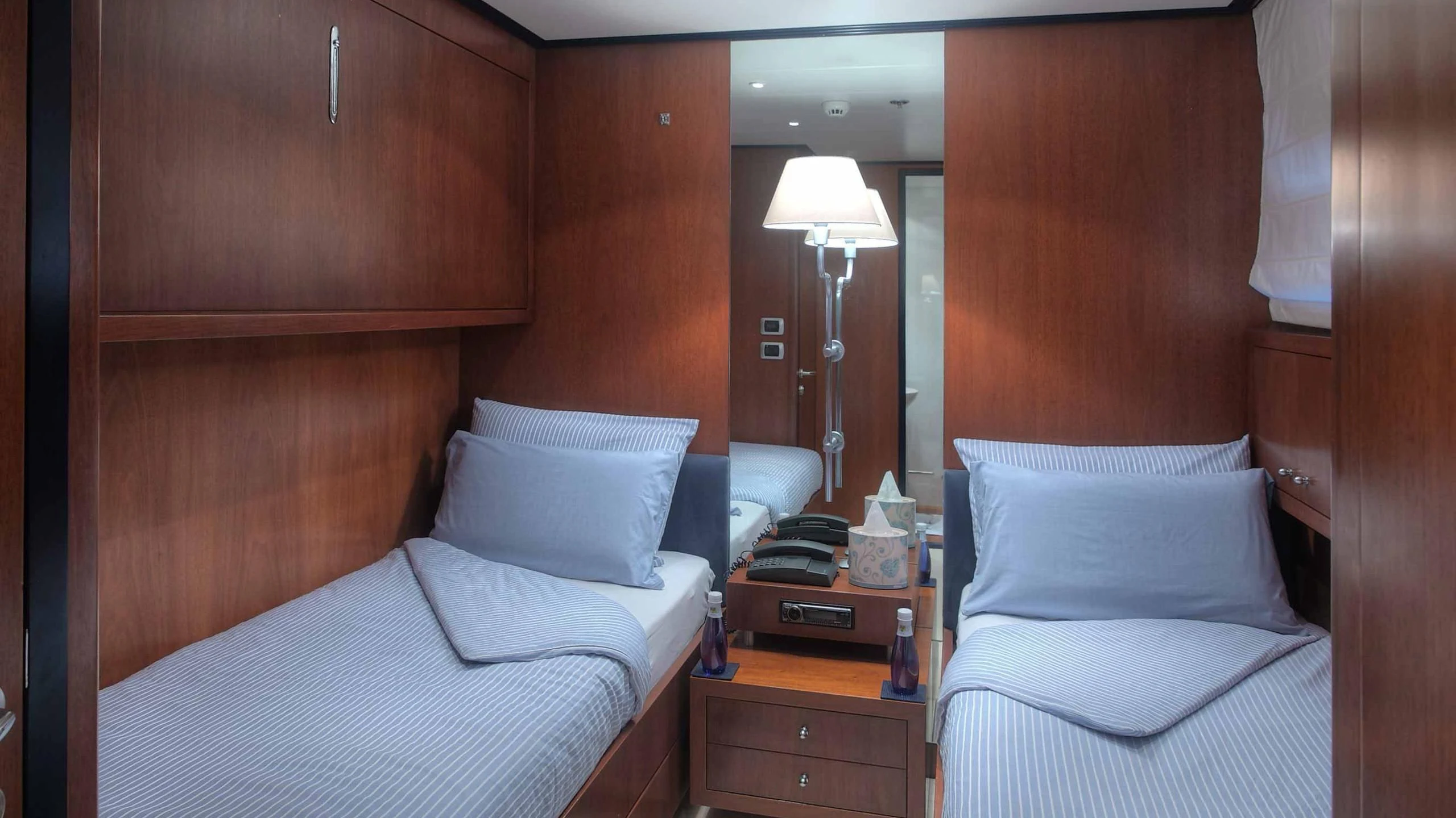 a room with two beds aboard CAROM Yacht for Sale