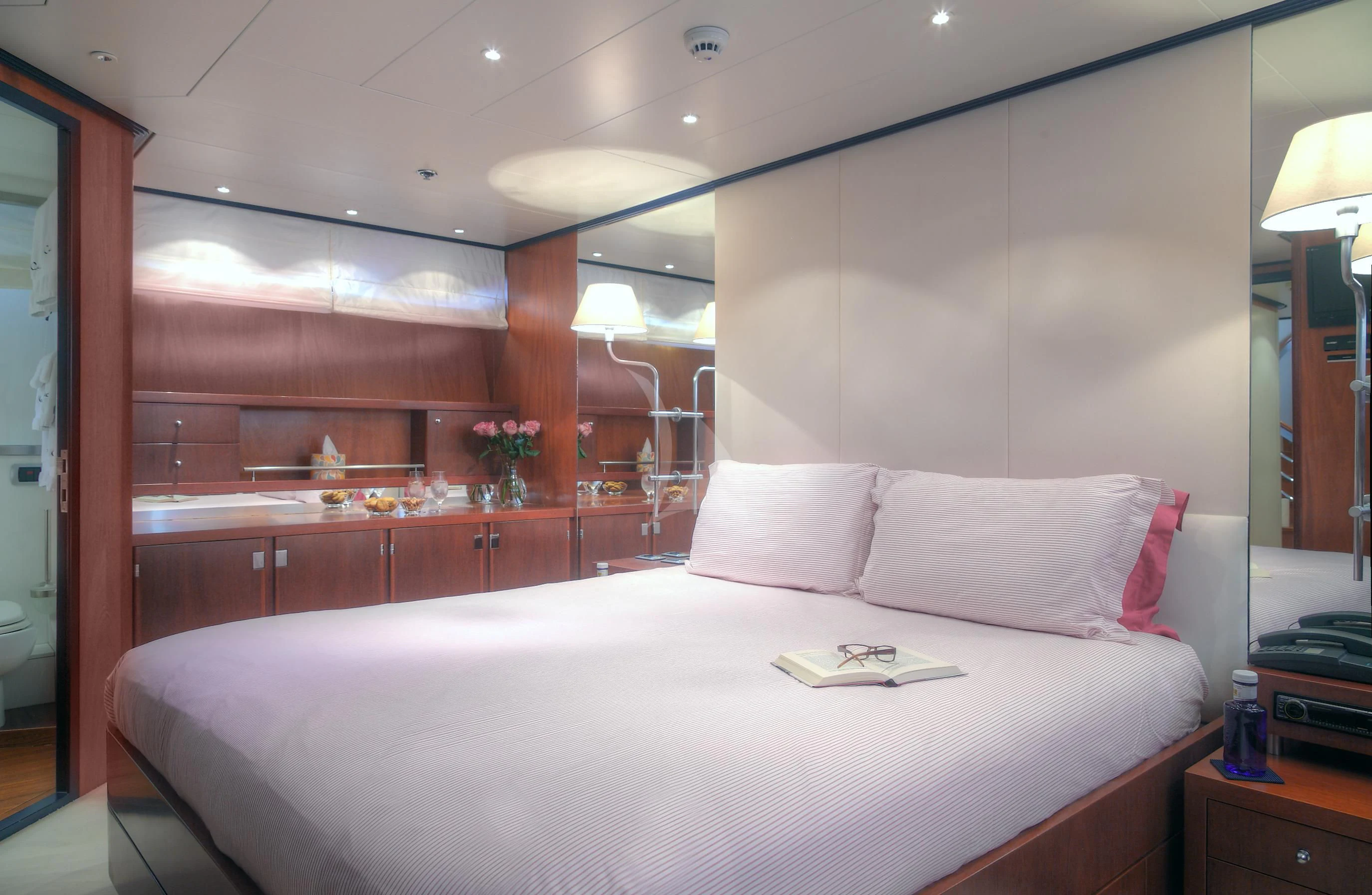 a bed with a white pillow aboard CAROM Yacht for Sale