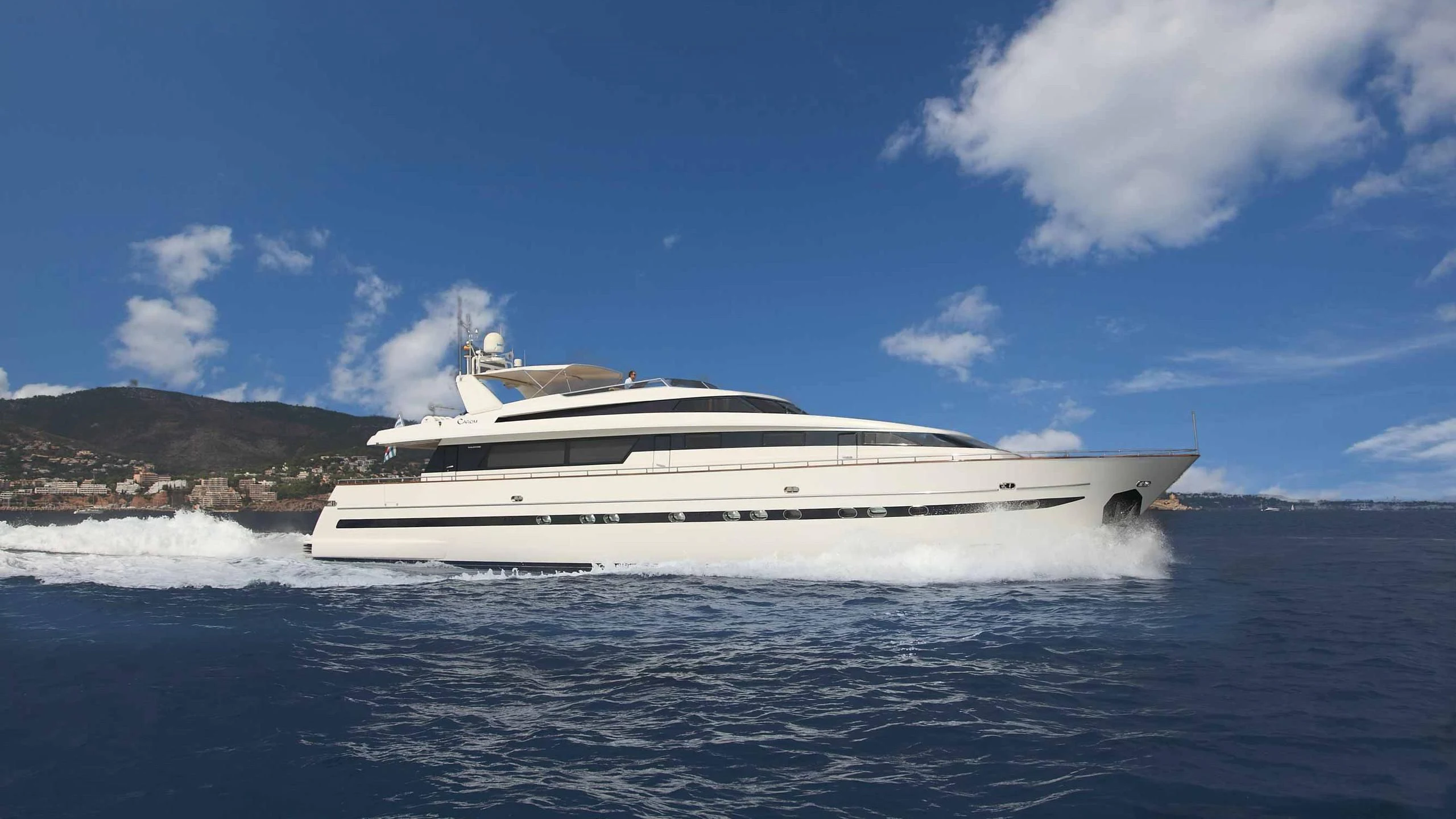 a white yacht on the water aboard CAROM Yacht for Sale
