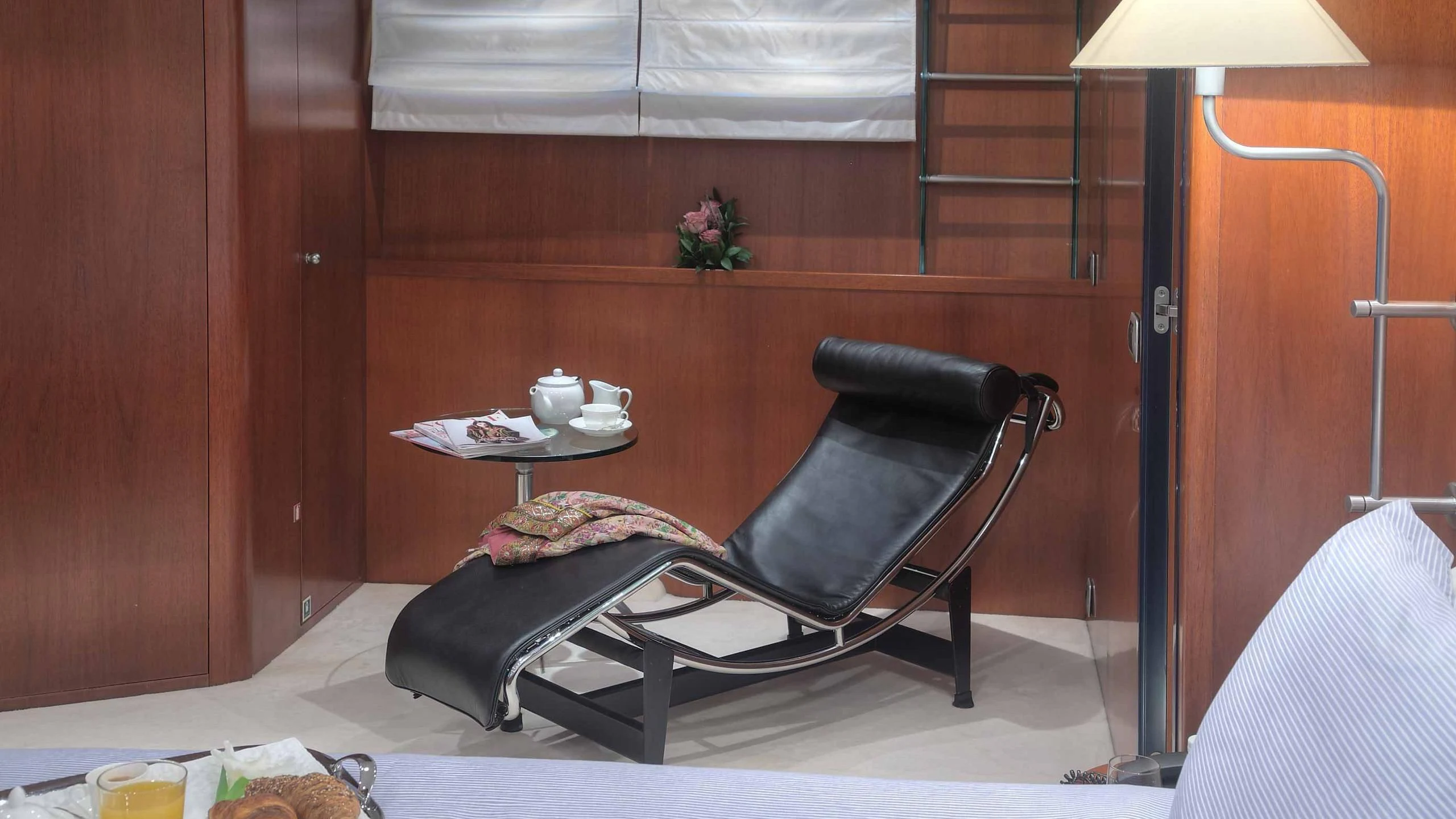 a black chair in a room aboard CAROM Yacht for Sale