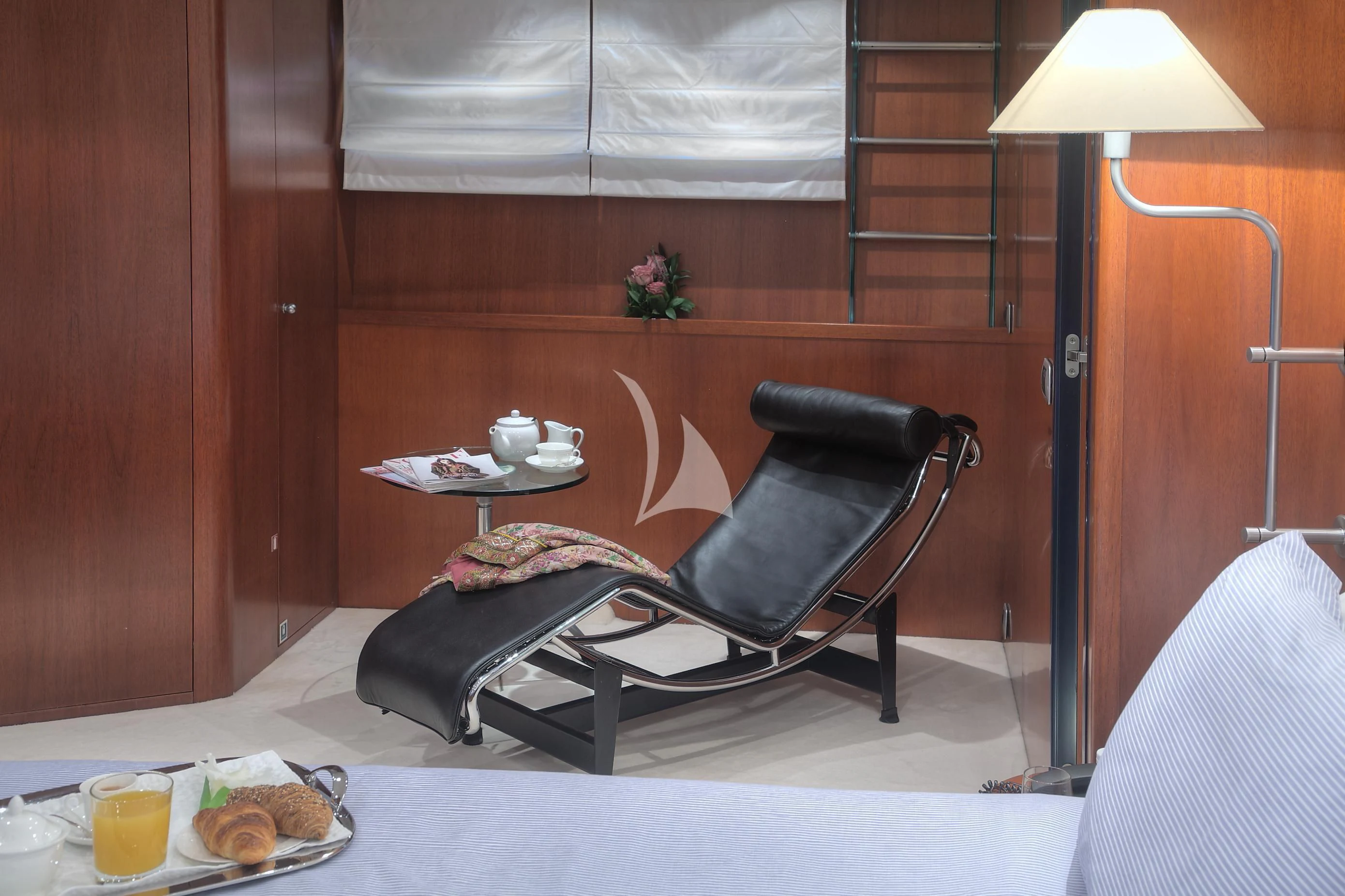 a black chair in a room aboard CAROM Yacht for Sale