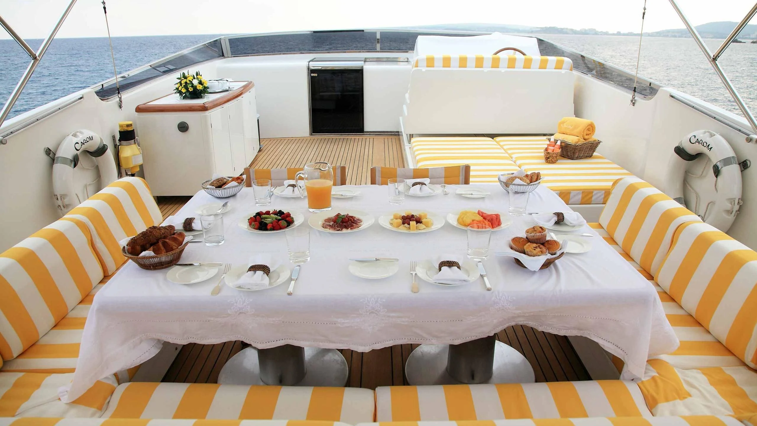 a table with food on it aboard CAROM Yacht for Sale
