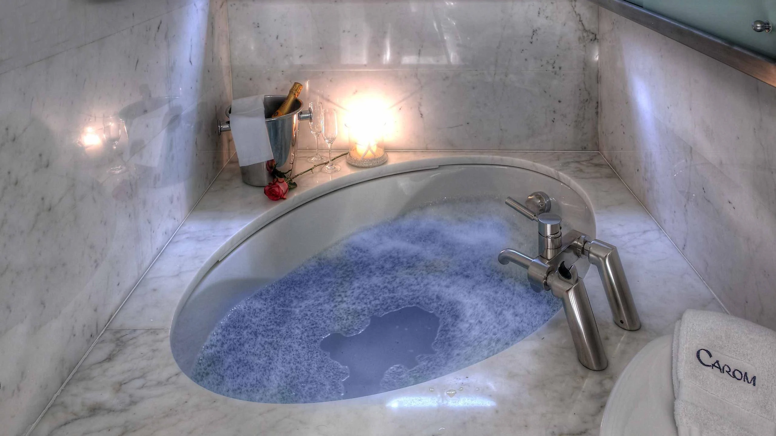 a bathtub with a faucet aboard CAROM Yacht for Sale