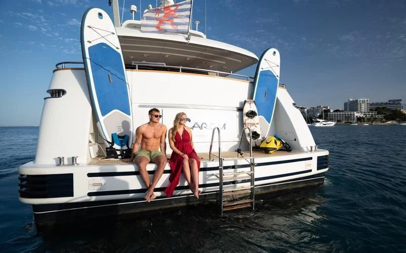 a group of people on a boat aboard CAROM Yacht for Sale