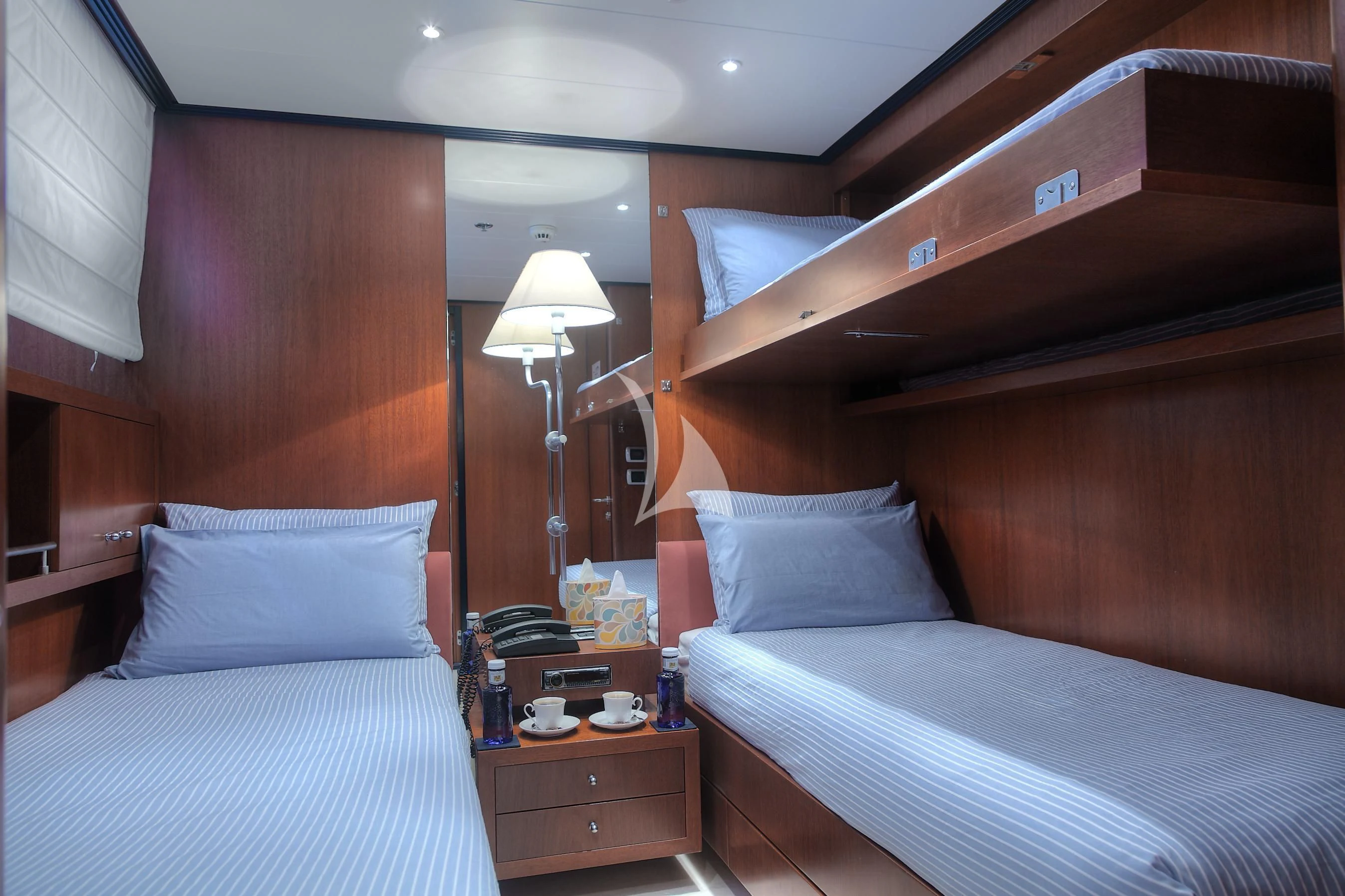 a room with two beds aboard CAROM Yacht for Sale