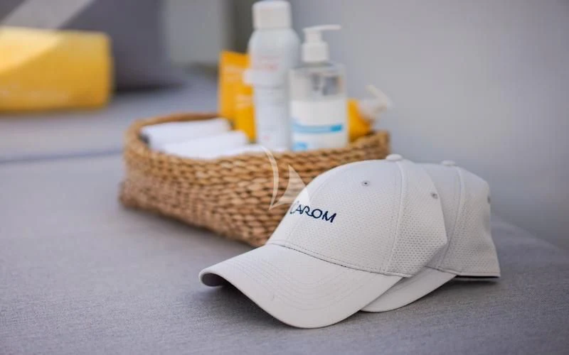 a white hat on a table aboard CAROM Yacht for Sale