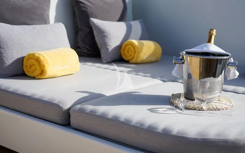 a glass jar on a bed aboard CAROM Yacht for Sale