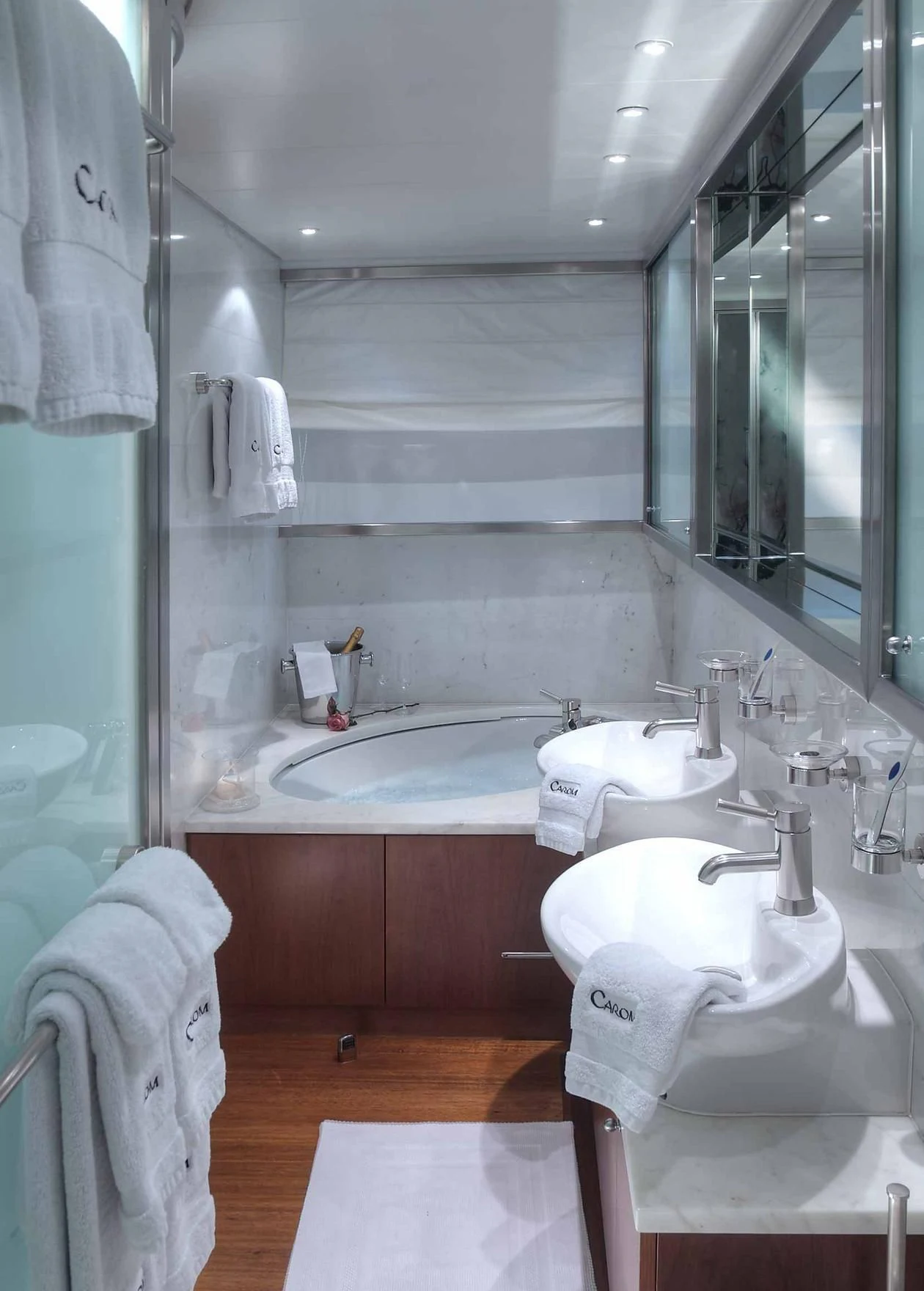 a bathroom with a sink and a mirror aboard CAROM Yacht for Sale