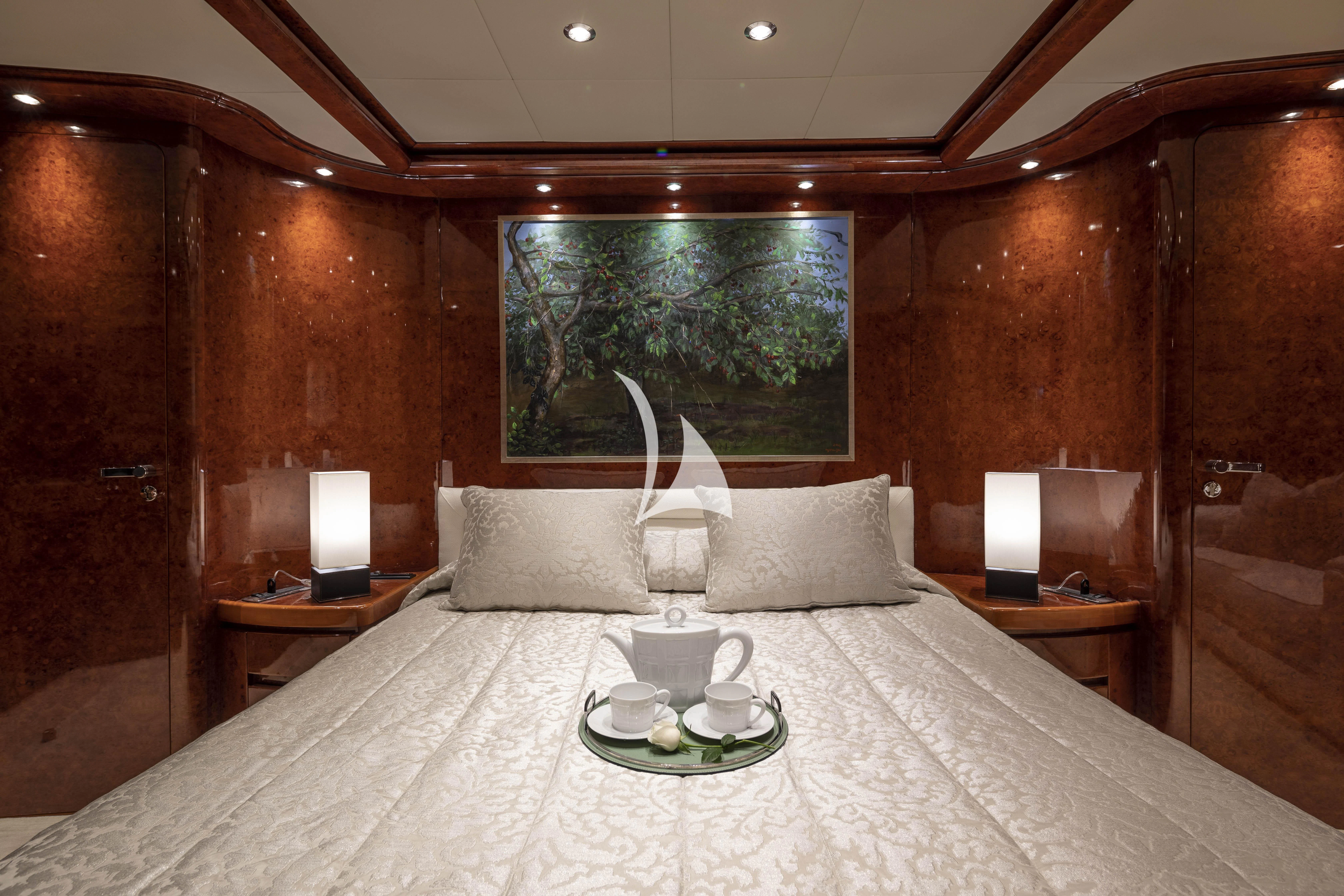 a bed with a white bed spread aboard SOLE DI MARE Yacht for Sale