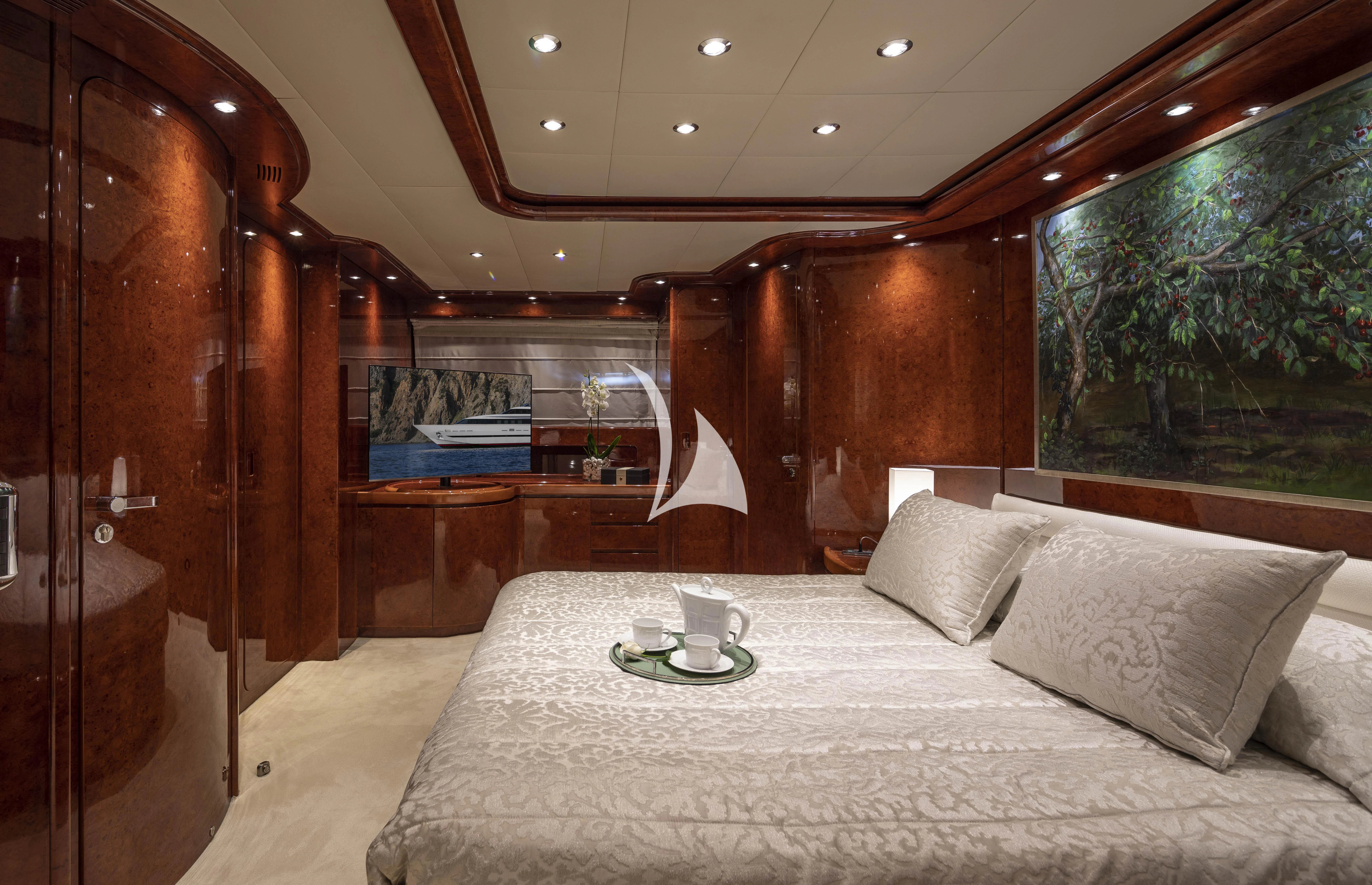 a bed with a tray of food on it aboard SOLE DI MARE Yacht for Sale