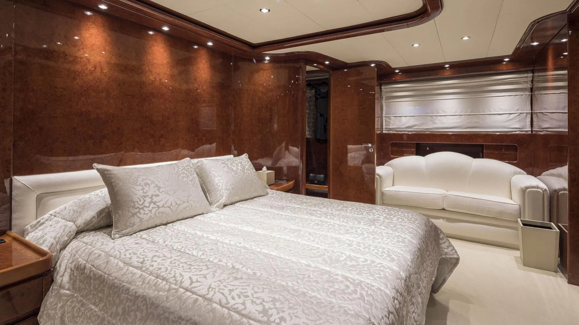 a room with a bed and a couch aboard SOLE DI MARE Yacht for Sale