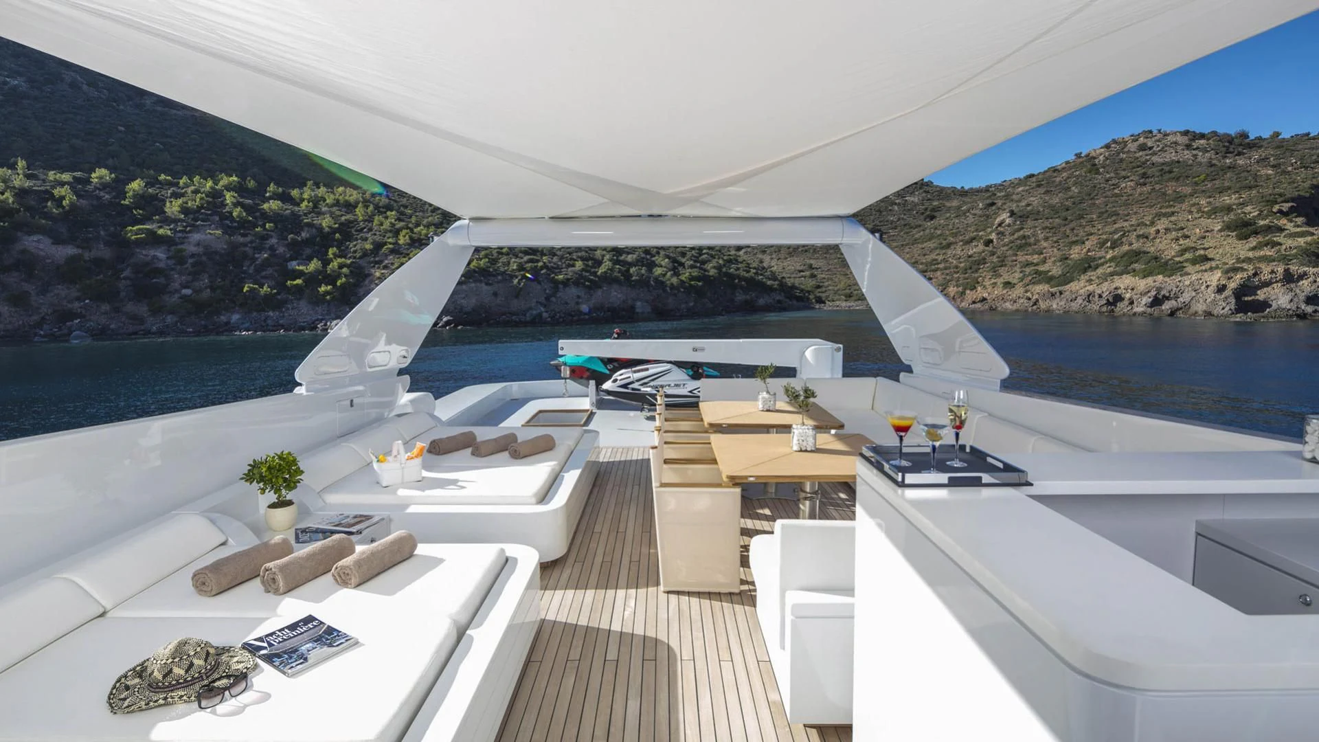 a room with a deck and a view of a city aboard SOLE DI MARE Yacht for Sale