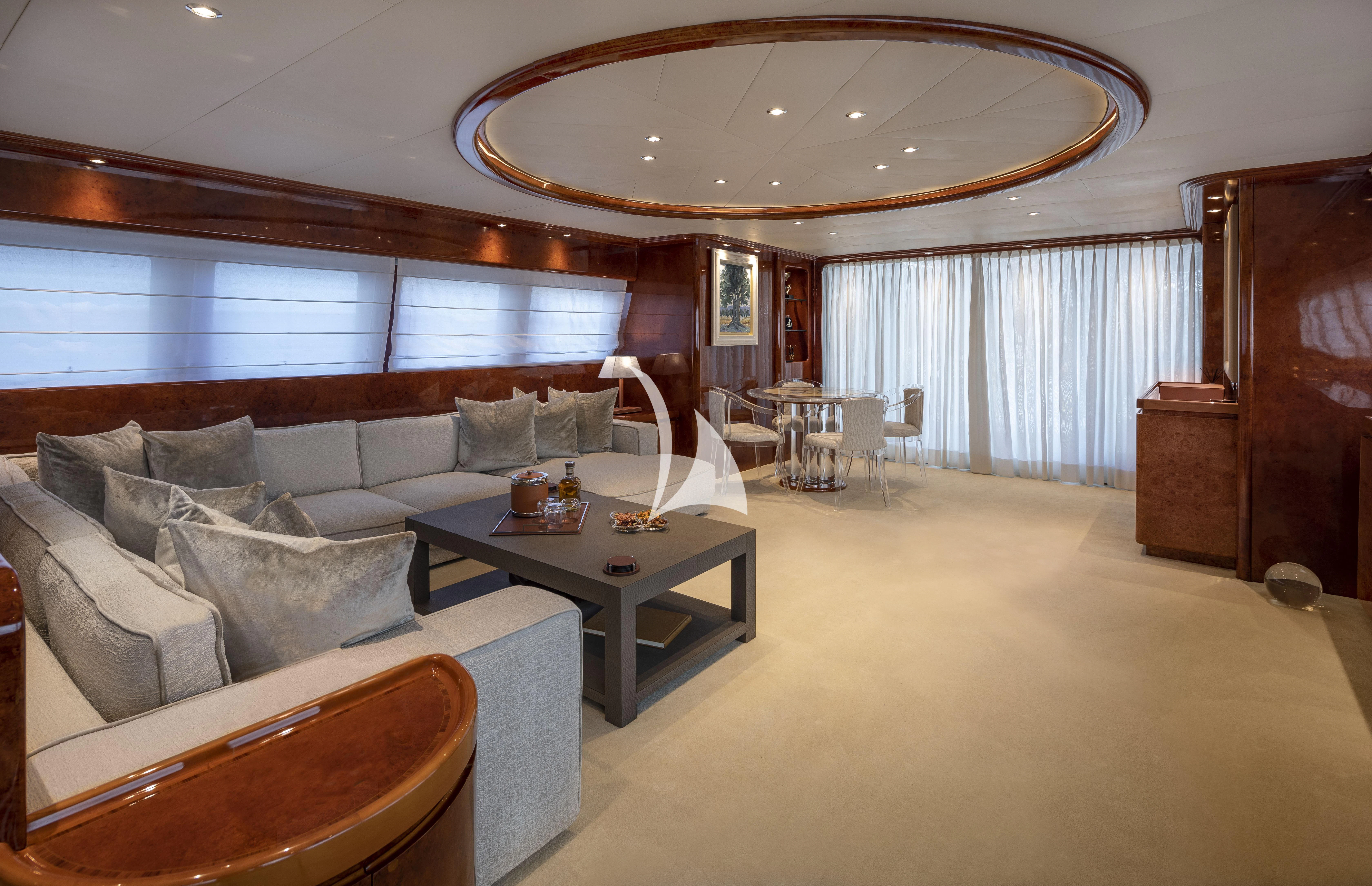 a large living room with a large chandelier aboard SOLE DI MARE Yacht for Sale