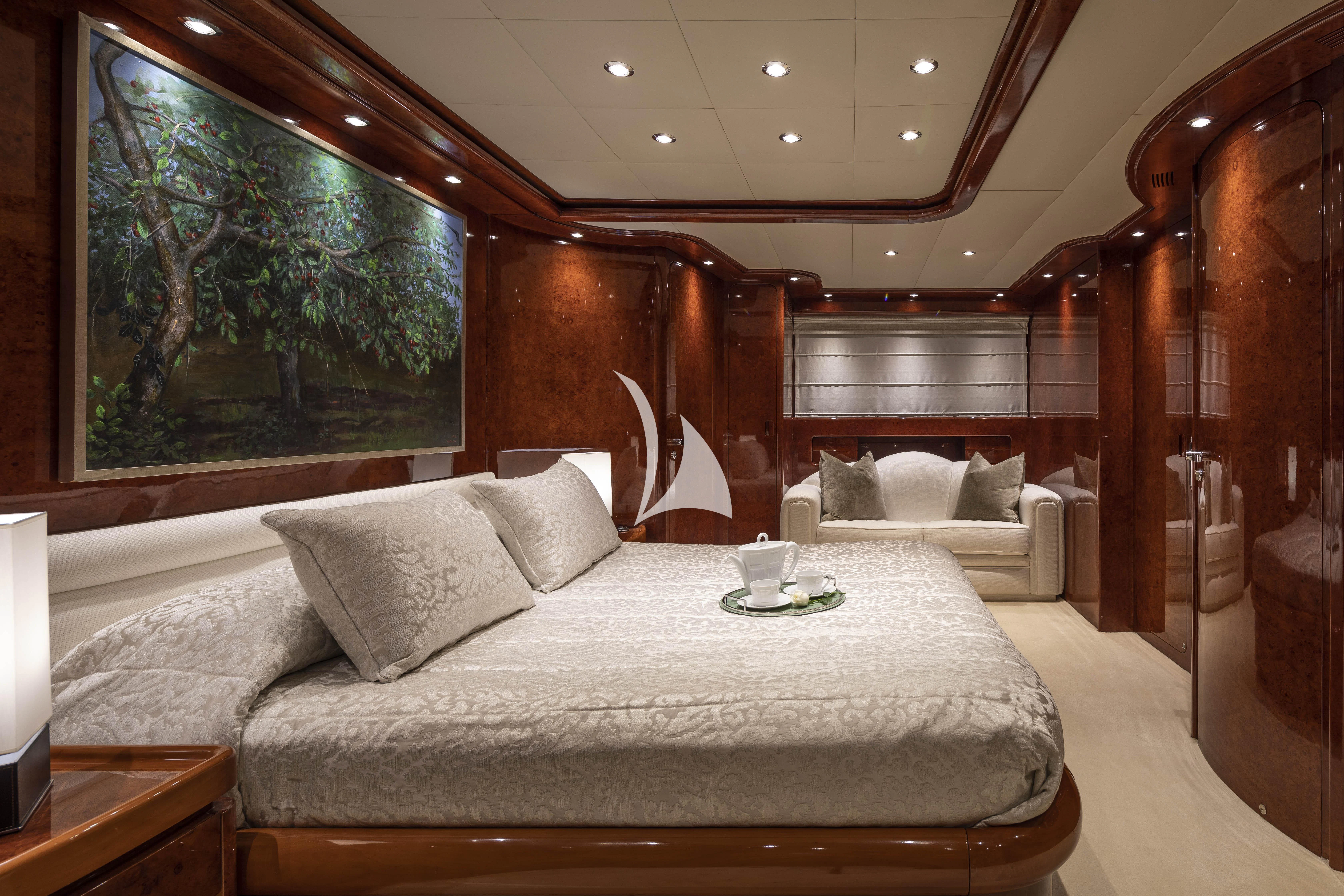 a room with a bed and a couch aboard SOLE DI MARE Yacht for Sale